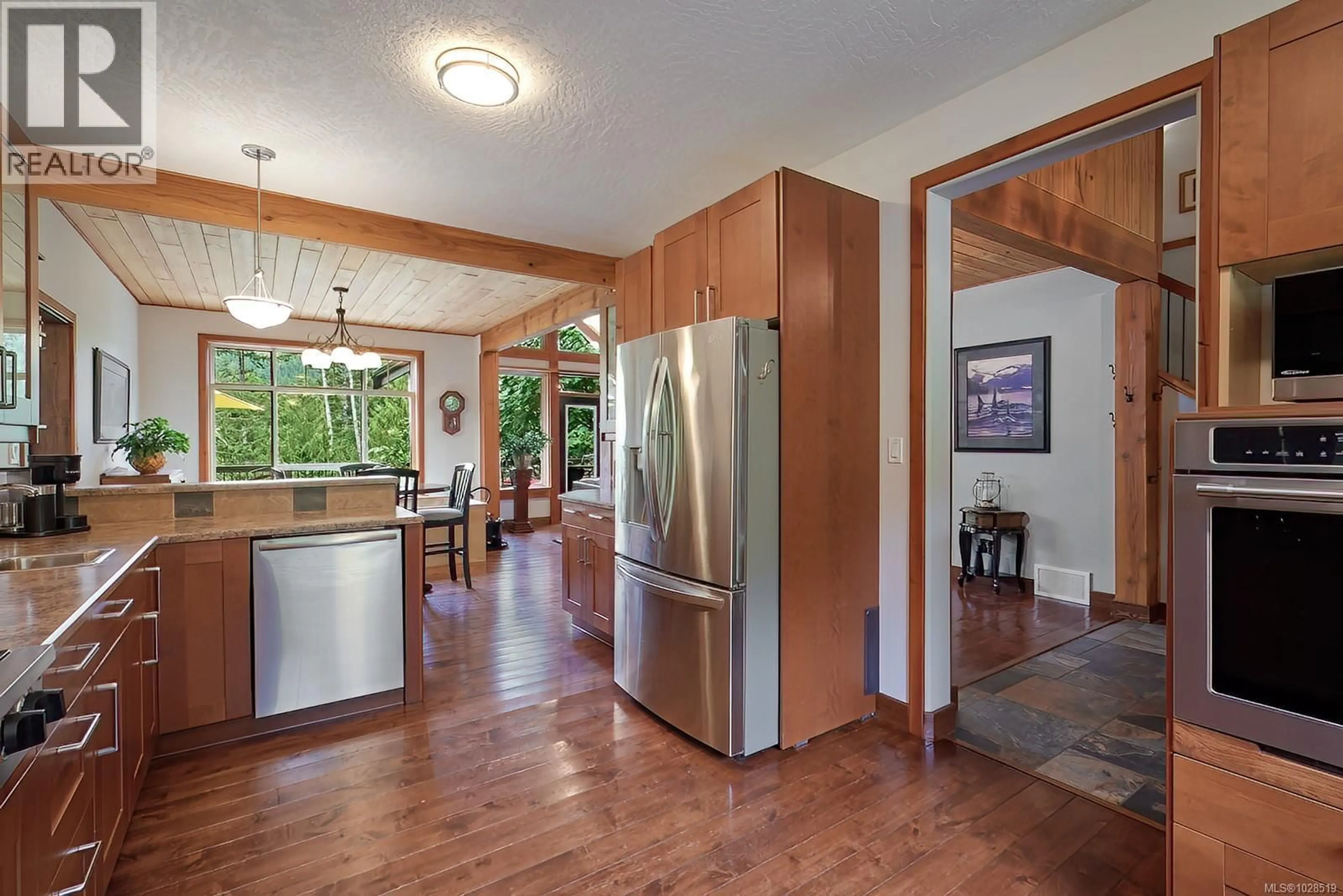 Open concept kitchen, wood/laminate floor for 1858 TAYLOR WALK, Qualicum Beach British Columbia V9K2S3