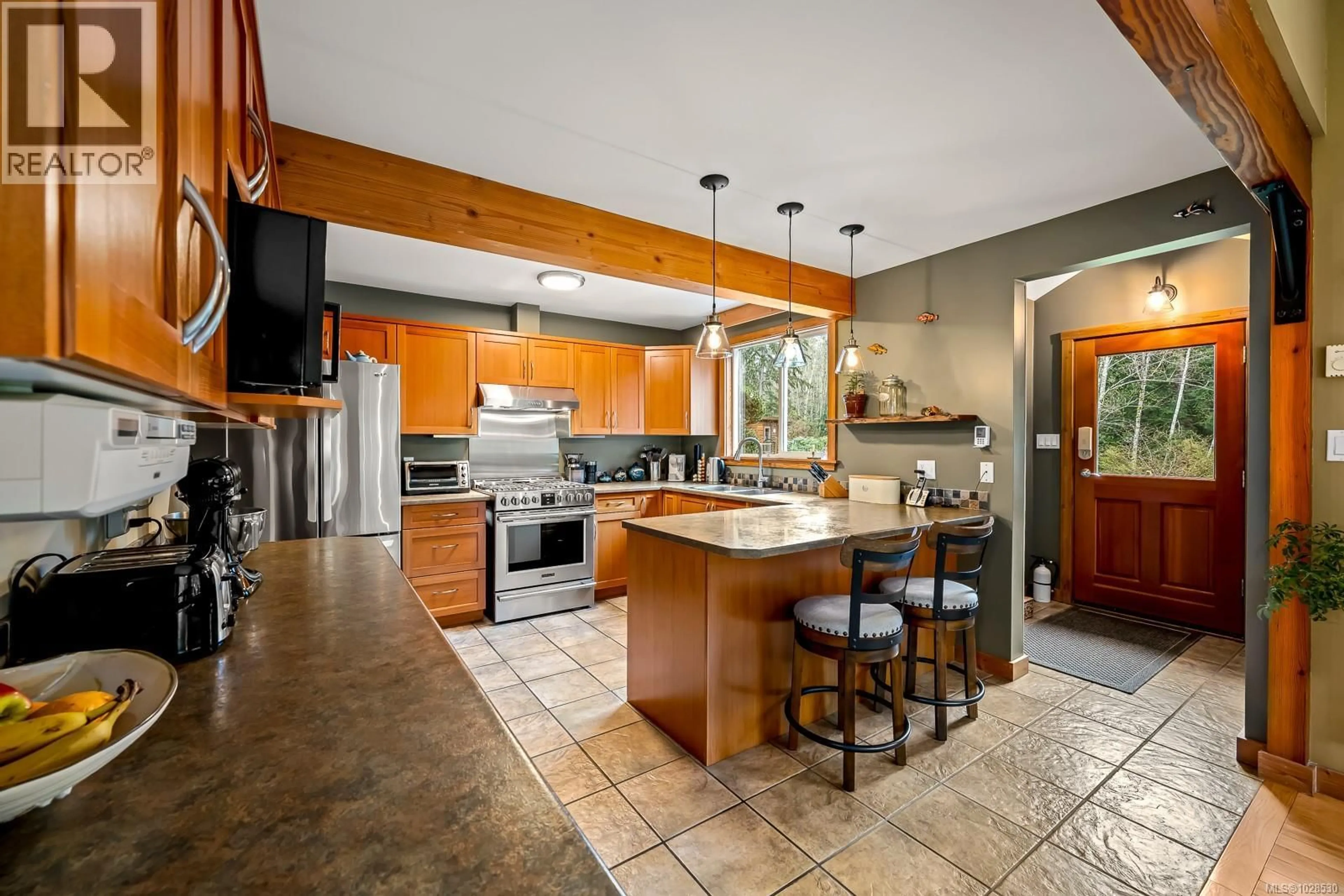 Open concept kitchen, ceramic/tile floor for 1590 CARRINGTON BAY ROAD, Whaletown British Columbia V0P1Z0
