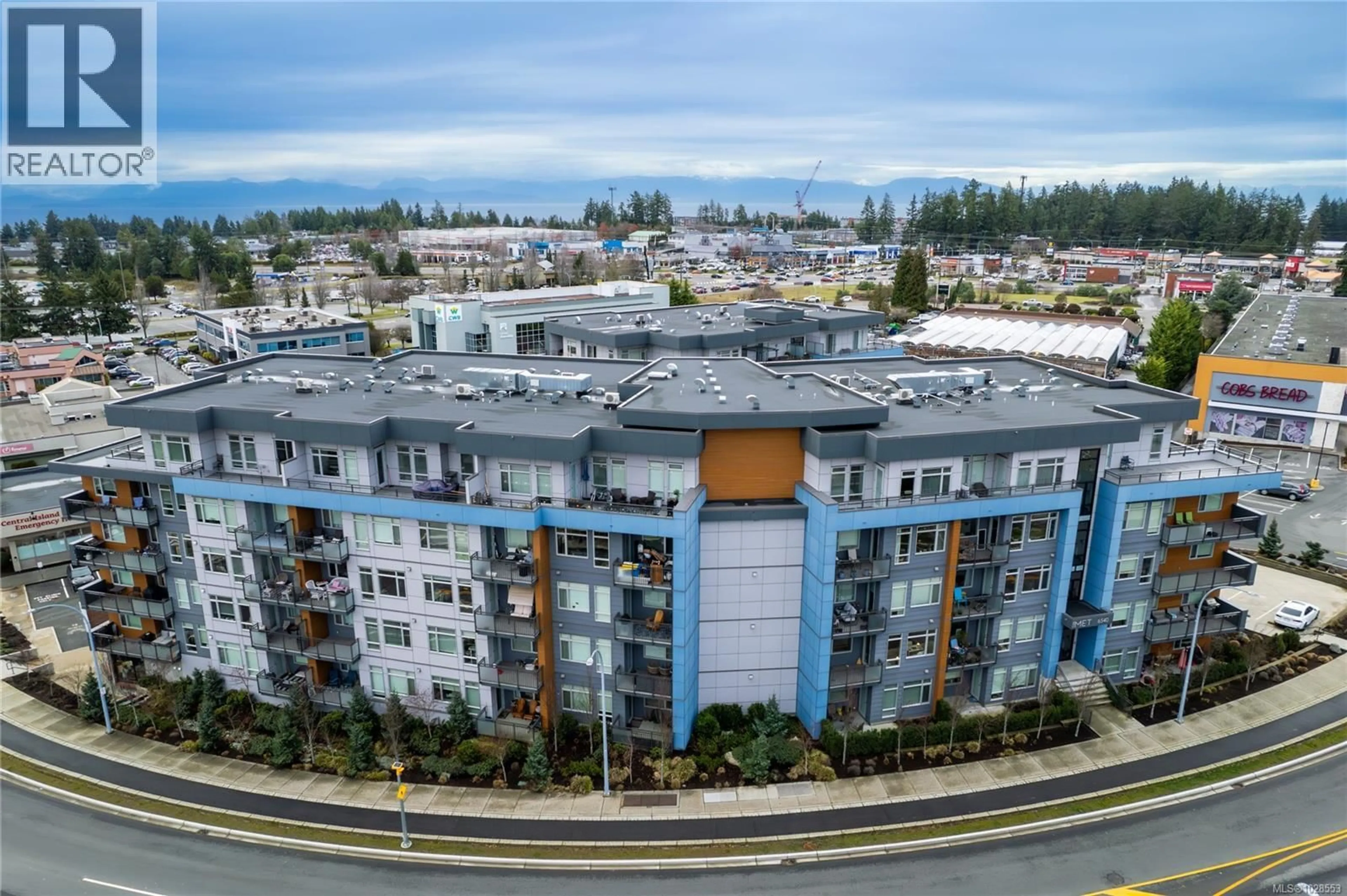 A pic from outside/outdoor area/front of a property/back of a property/a pic from drone, unknown for 202 - 6540 METRAL DRIVE, Nanaimo British Columbia V9T2L8