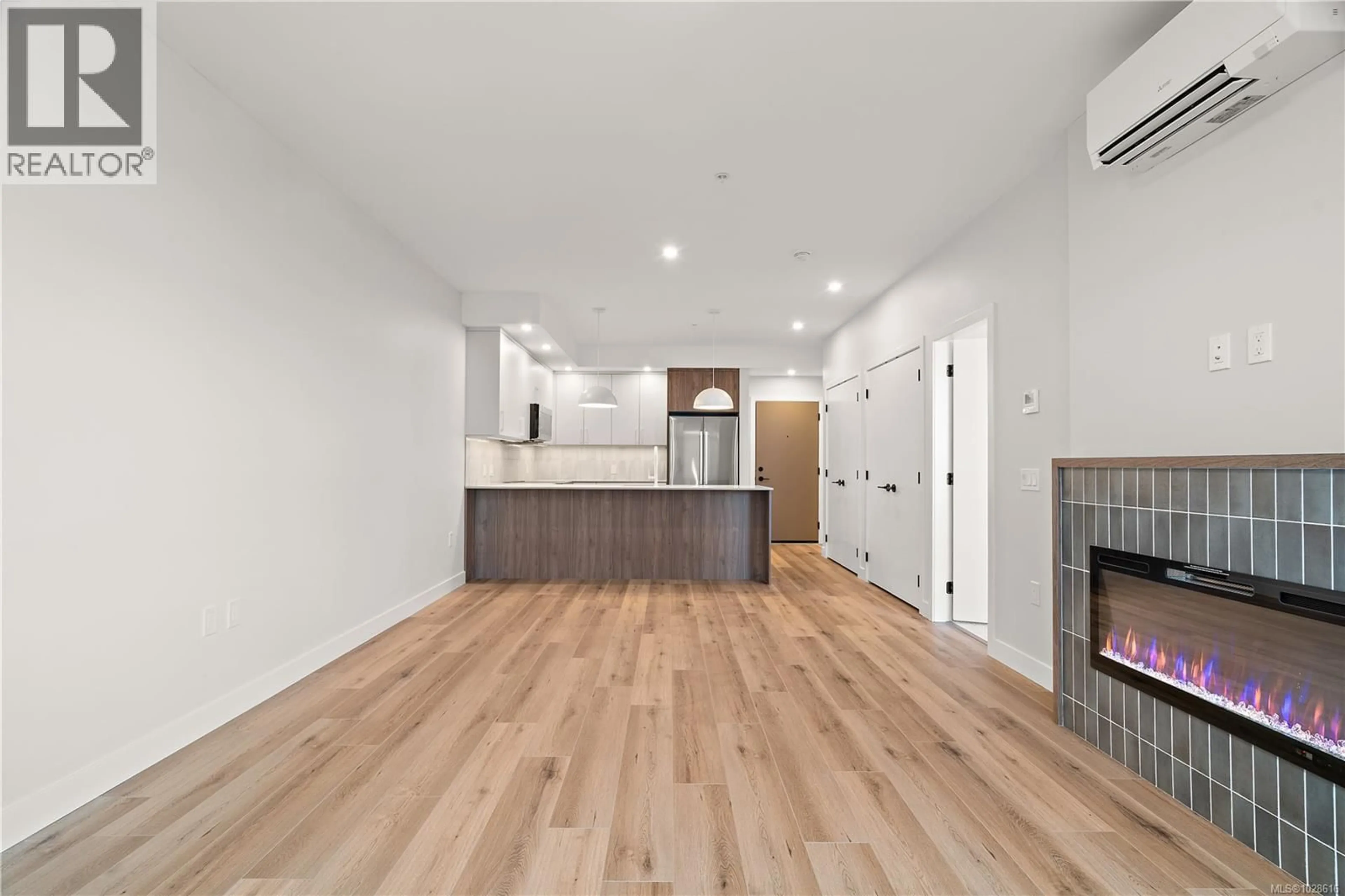 Open concept kitchen, wood/laminate floor for 613 - 2881 LEIGH ROAD, Langford British Columbia V9B4G5