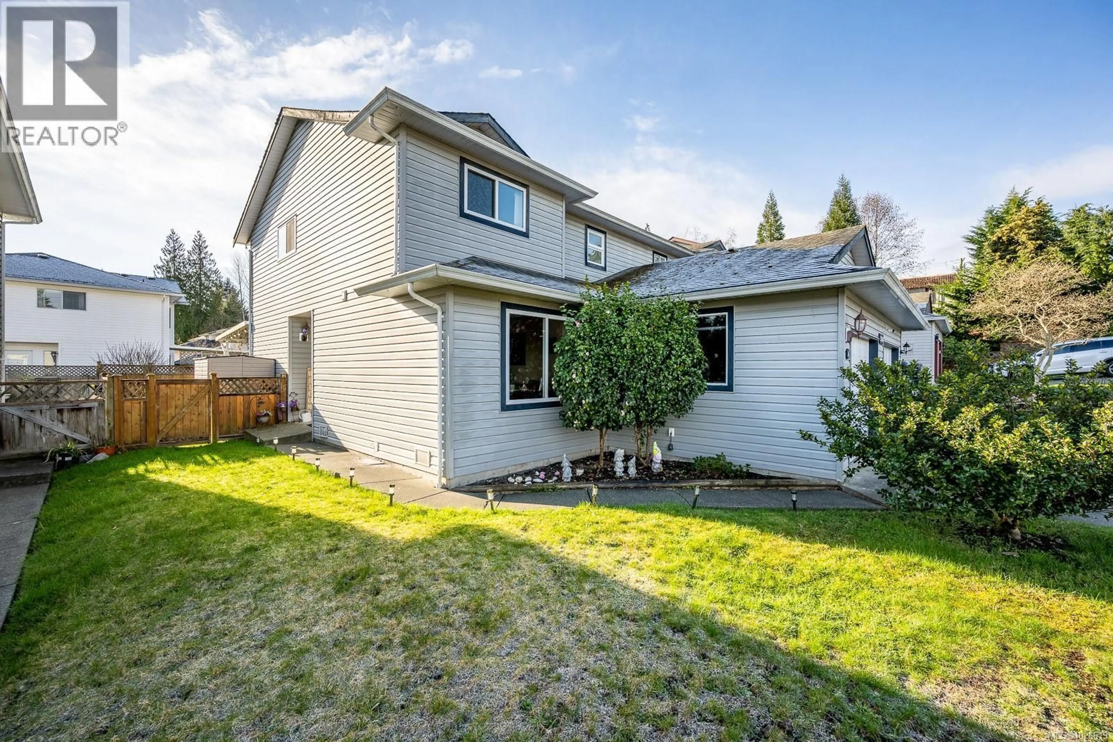 Home with vinyl exterior material, street for A - 2284 1ST STREET, Courtenay British Columbia V9N8X8