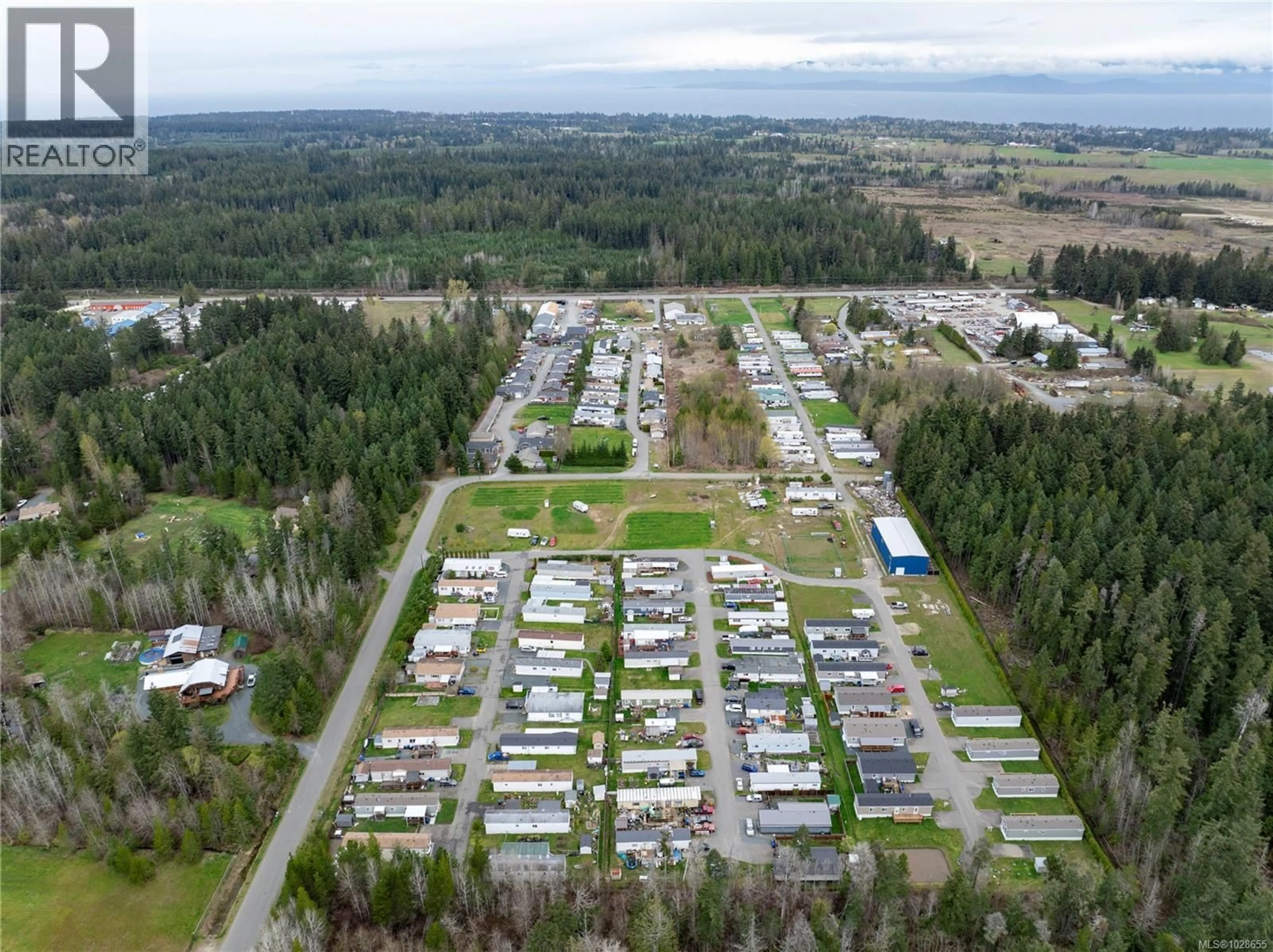 A pic from outside/outdoor area/front of a property/back of a property/a pic from drone, unknown for 47 - 1720 WHIBLEY ROAD, Coombs British Columbia V0R1M0