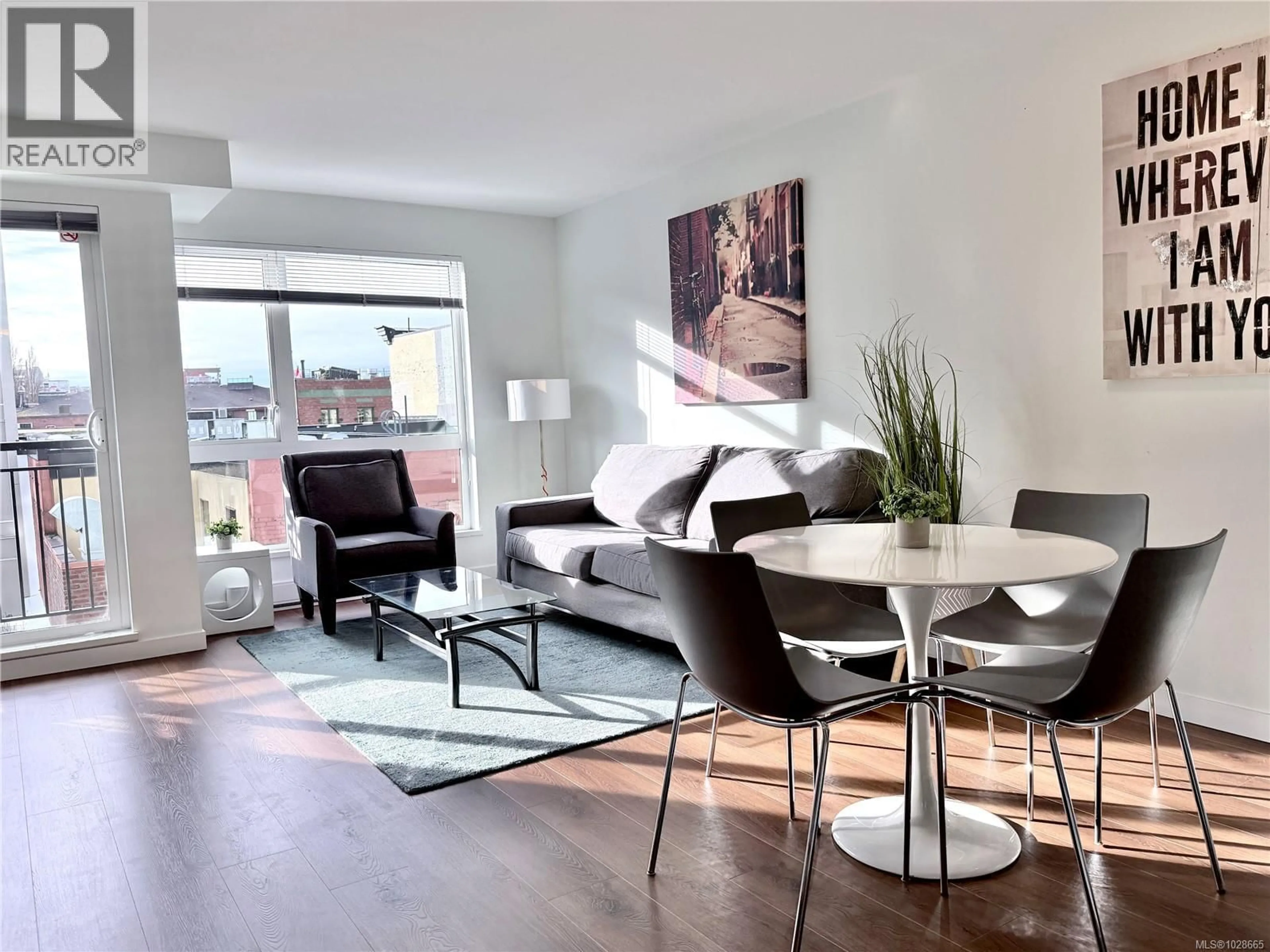 Living room with furniture, wood/laminate floor for 310 - 517 FISGARD STREET, Victoria British Columbia V8W0C5