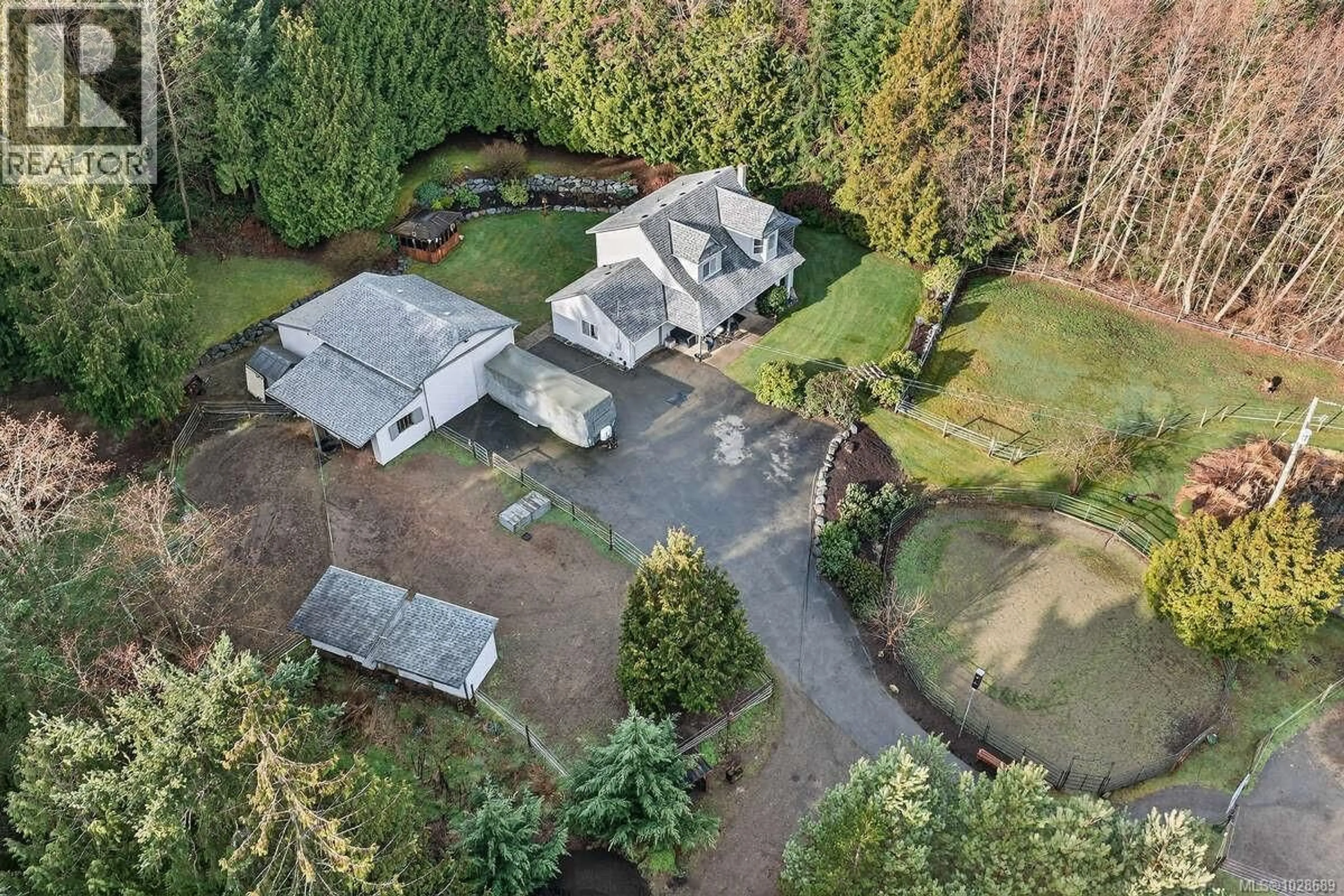 A pic from outside/outdoor area/front of a property/back of a property/a pic from drone, street for 1136 CORCAN ROAD, Qualicum Beach British Columbia V9K2R6