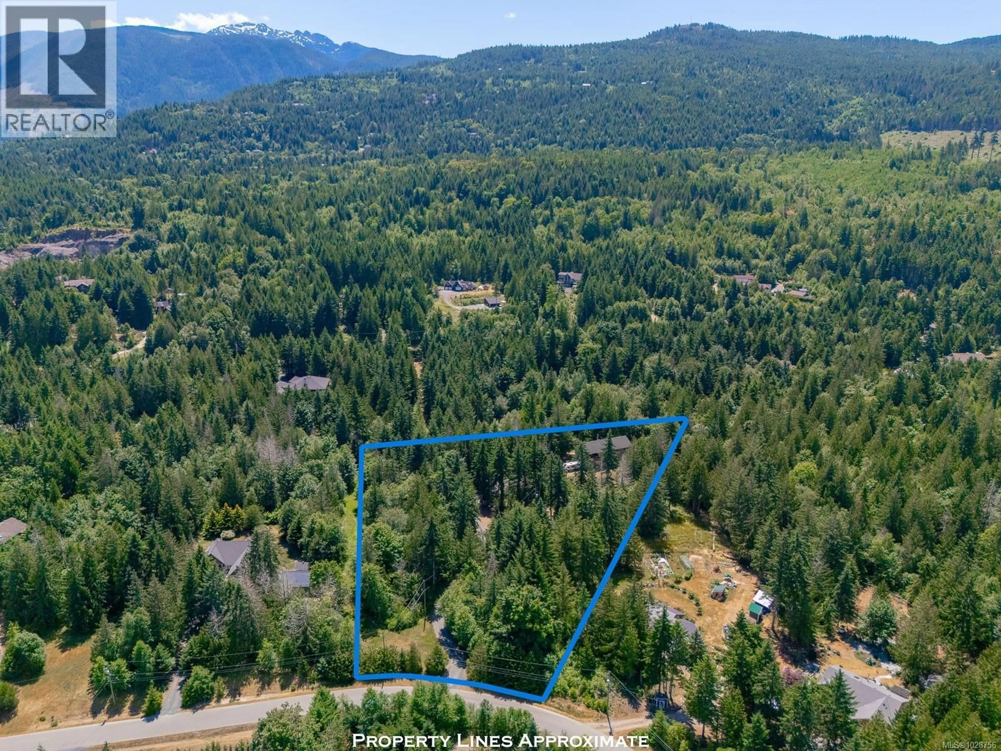 A pic from outside/outdoor area/front of a property/back of a property/a pic from drone, forest/trees view for 1890 PIERCE WAY, Qualicum Beach British Columbia V9K2V1