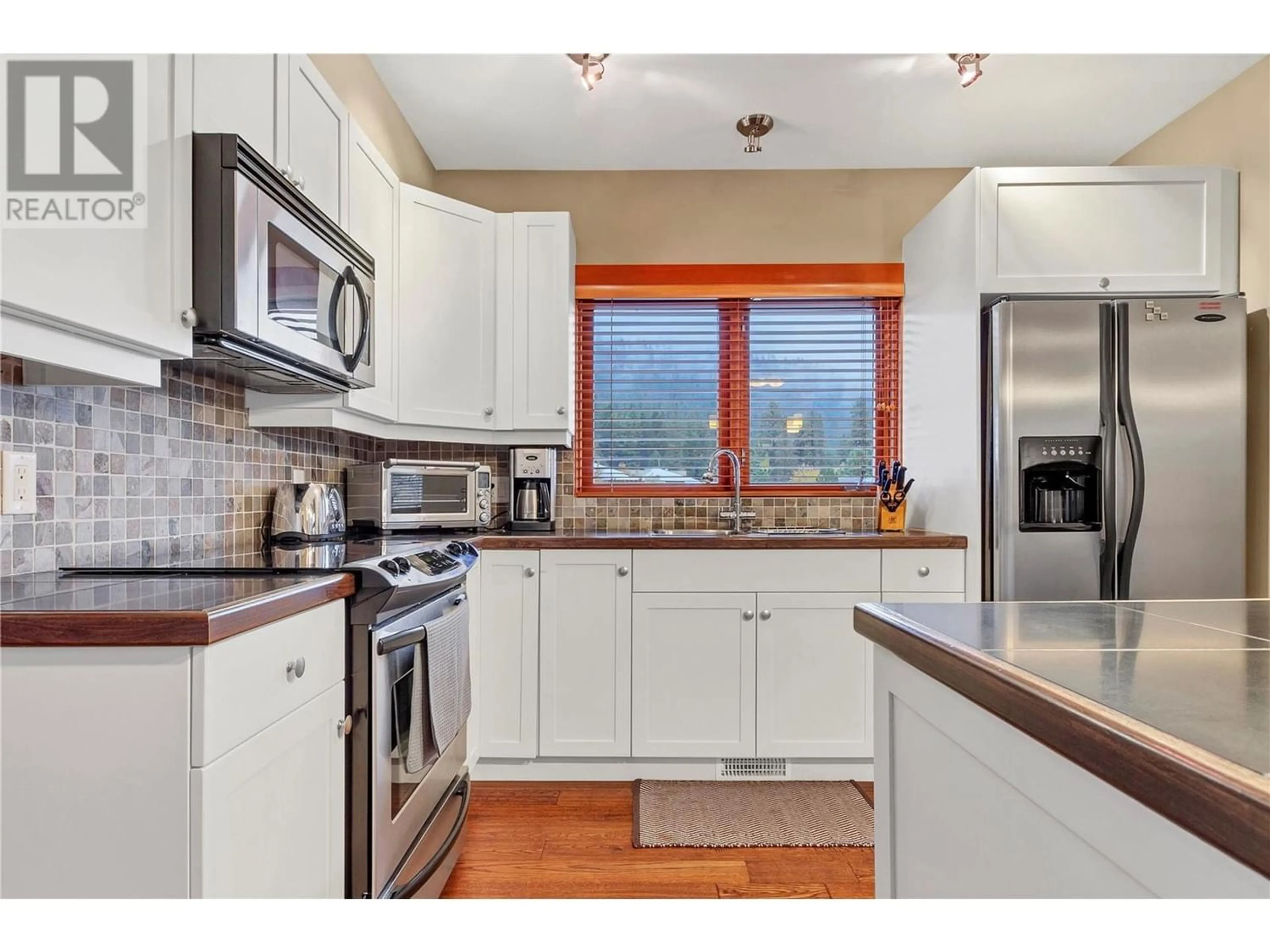 Open concept kitchen for 9845 Eastside Road Unit# 96, Vernon British Columbia V1H1Z2