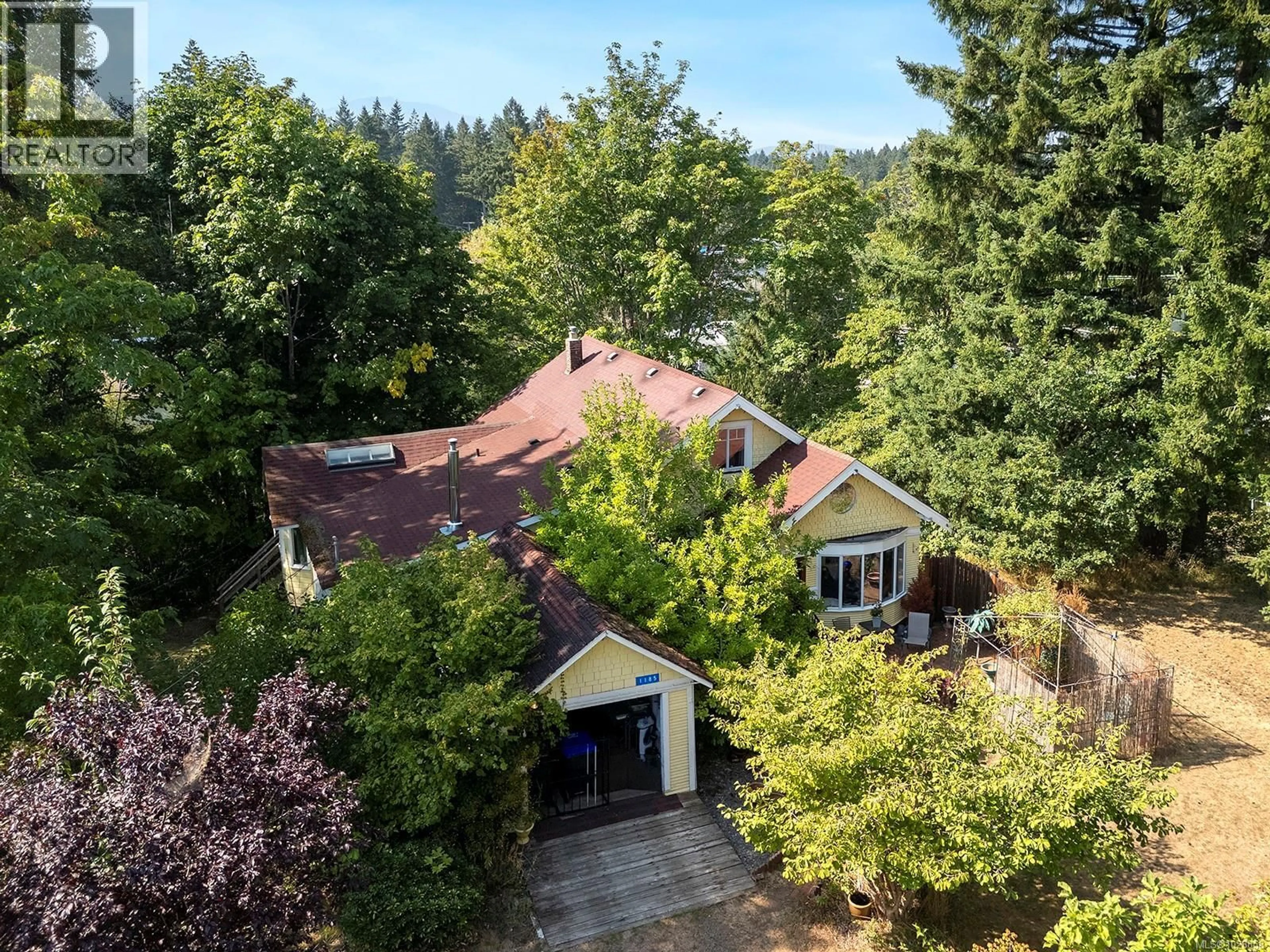 A pic from outside/outdoor area/front of a property/back of a property/a pic from drone, forest/trees view for 1185 5TH STREET, Courtenay British Columbia V9N1L7