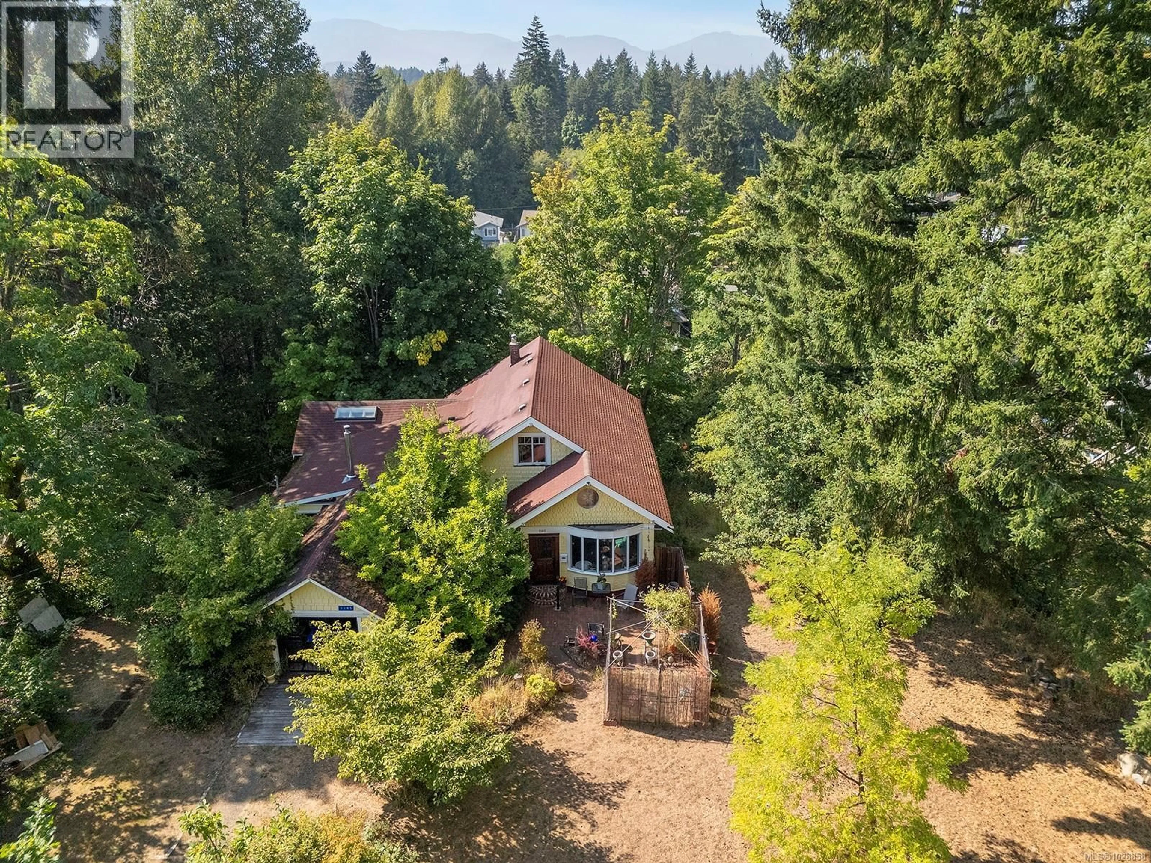 A pic from outside/outdoor area/front of a property/back of a property/a pic from drone, forest/trees view for 1185 5TH STREET, Courtenay British Columbia V9N1L7