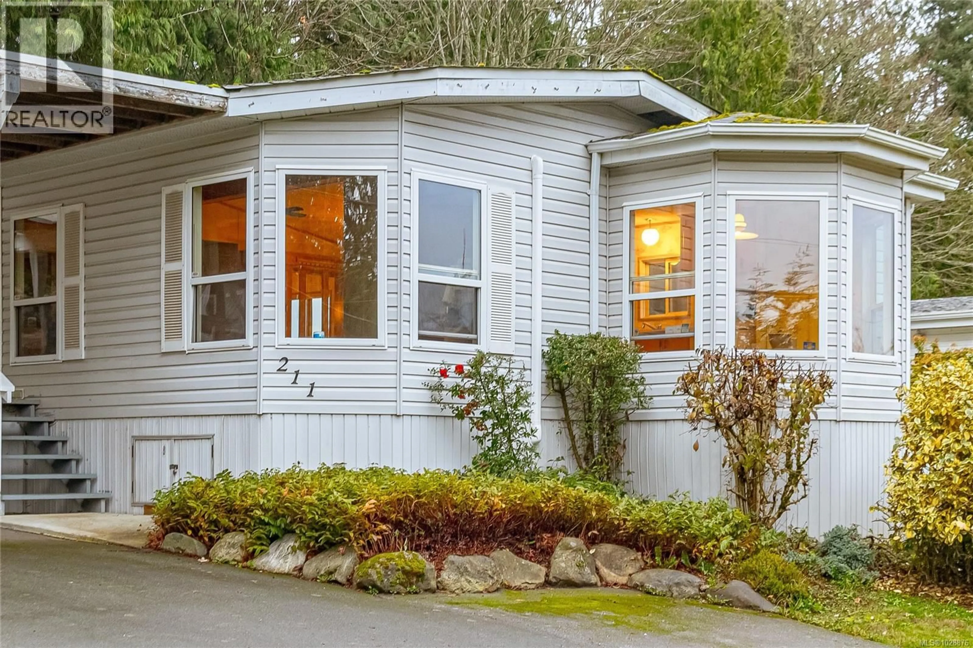 Home with vinyl exterior material, street for 211 - 2779 STAUTW ROAD, Central Saanich British Columbia V8M2C8