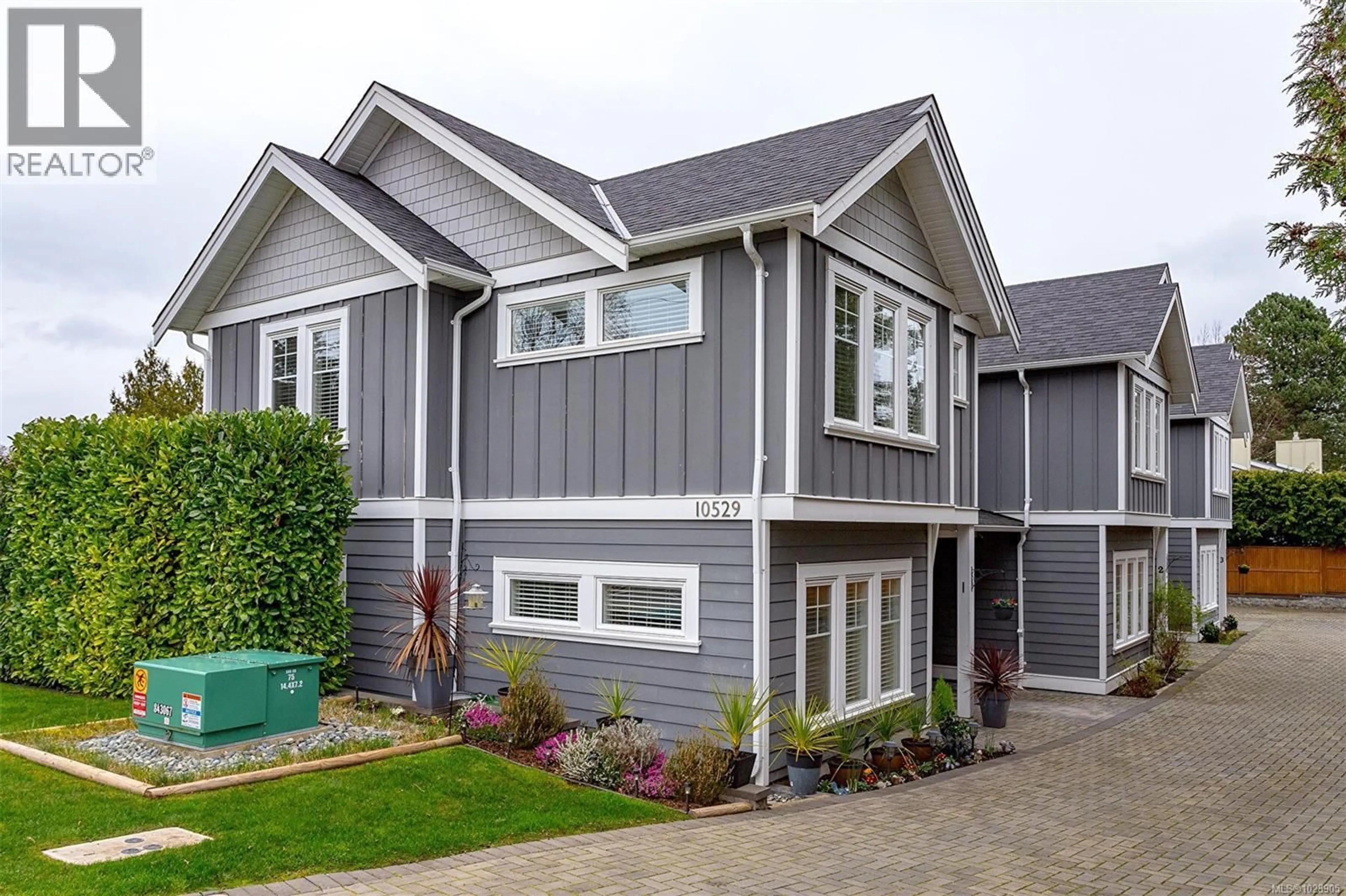 Home with vinyl exterior material, street for 1 - 10529 MCDONALD PARK ROAD, Sidney British Columbia V8L3J2