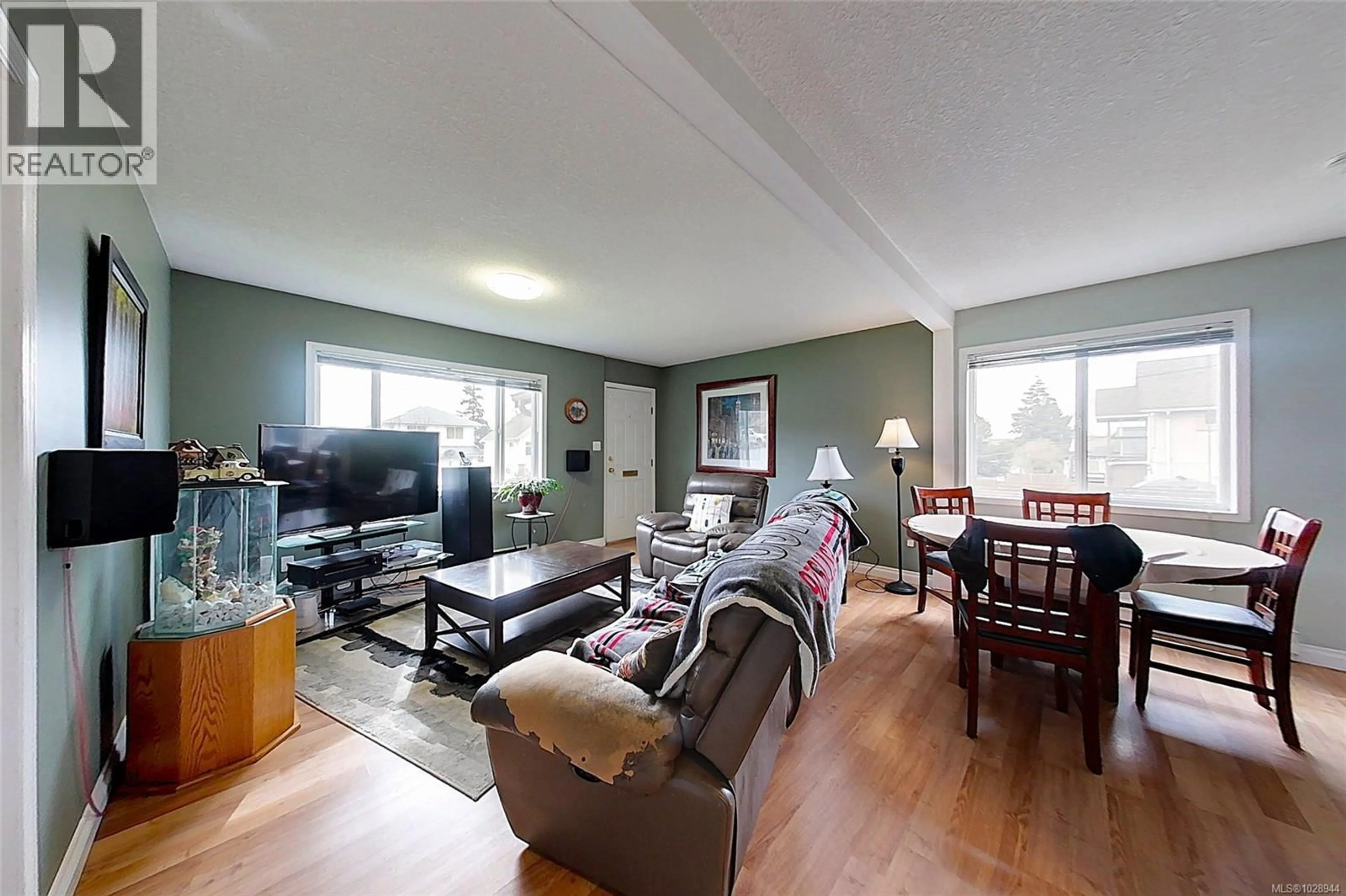 Living room with furniture, wood/laminate floor for 4469 LATHOM ROAD, Port Alberni British Columbia V9Y5S8
