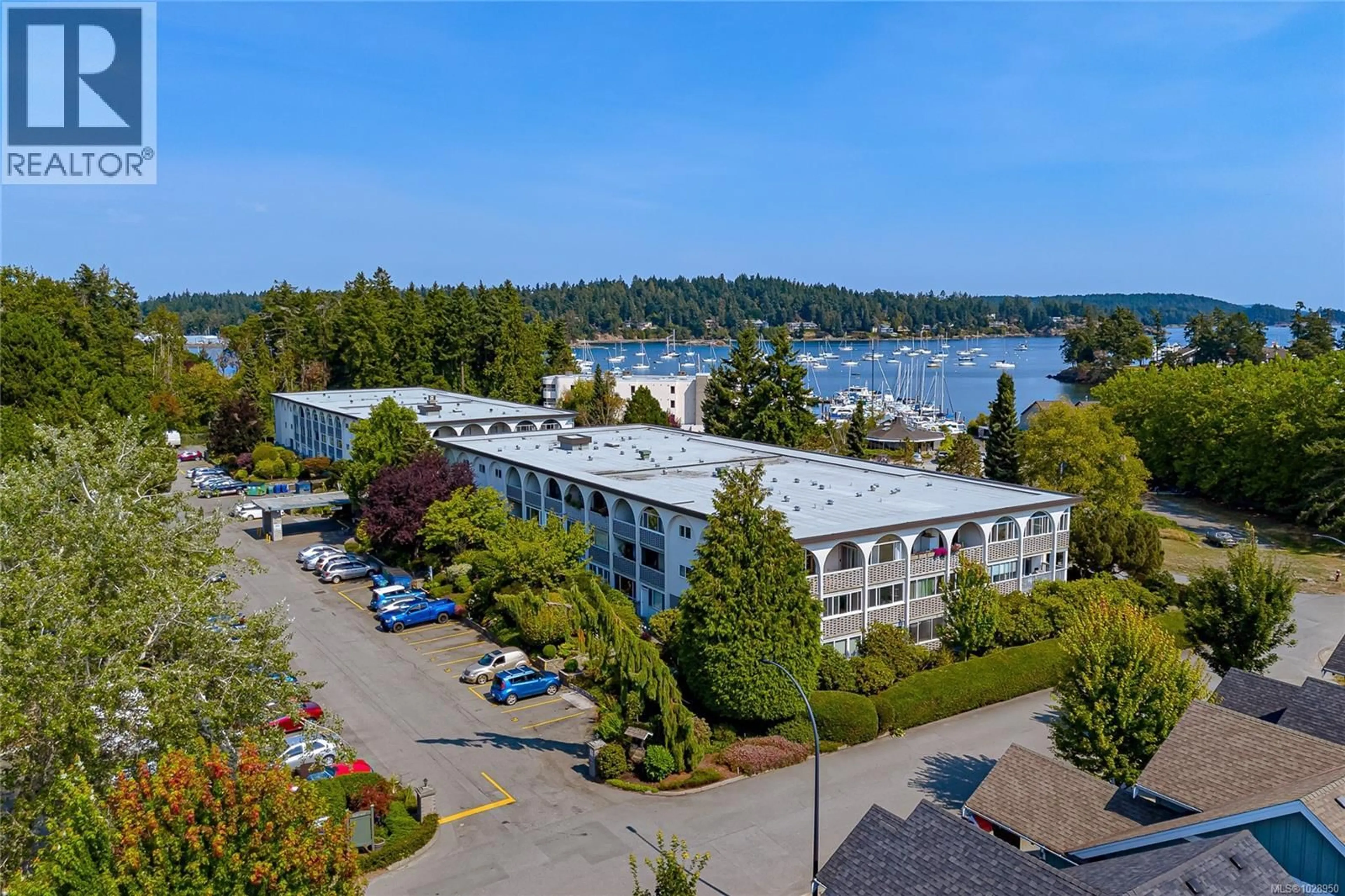 A pic from outside/outdoor area/front of a property/back of a property/a pic from drone, water/lake/river/ocean view for 108 - 2040 WHITE BIRCH ROAD, Sidney British Columbia V8L2R1