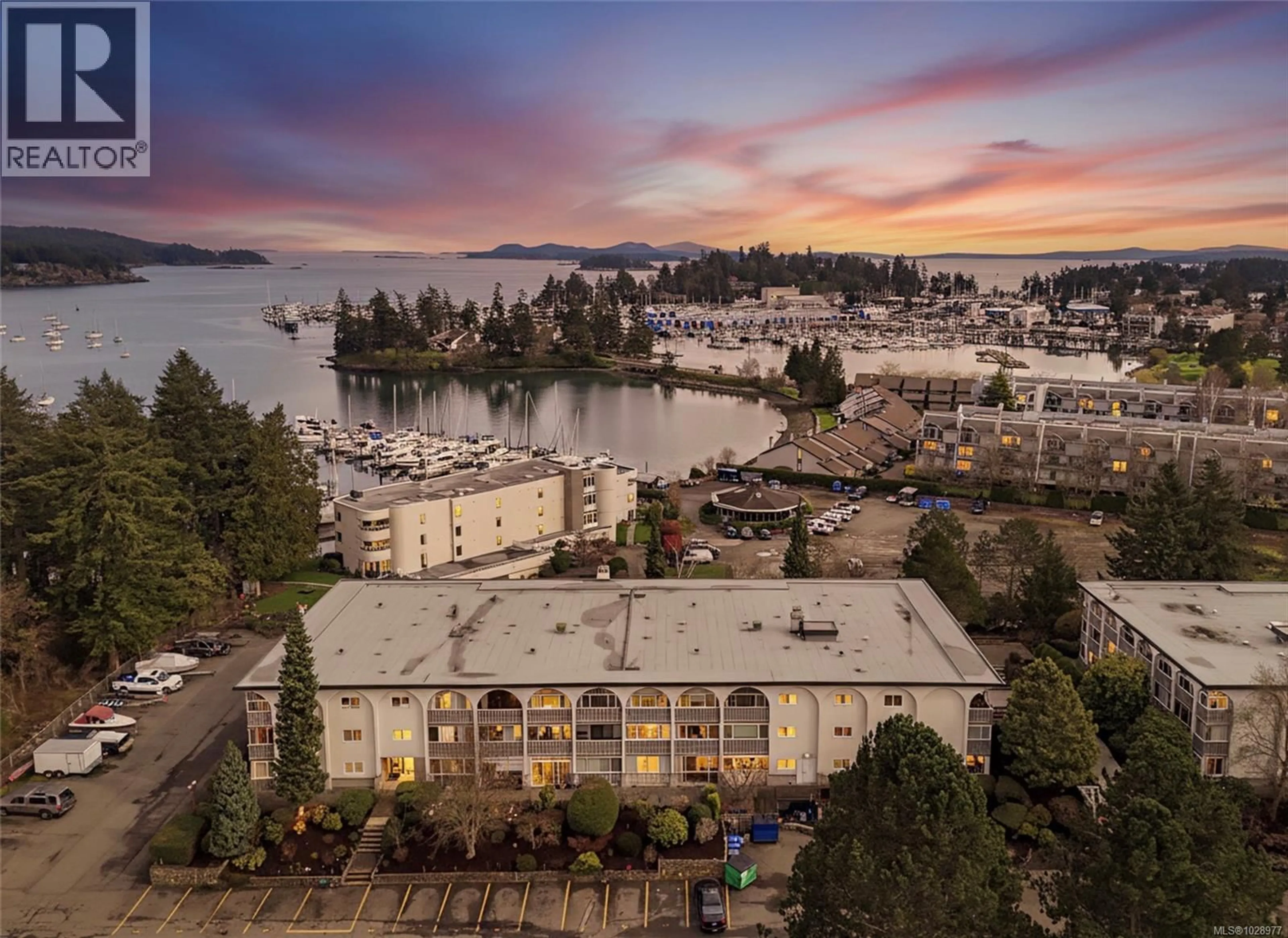 A pic from outside/outdoor area/front of a property/back of a property/a pic from drone, water/lake/river/ocean view for 301 - 2050 WHITE BIRCH ROAD, Sidney British Columbia V8L2R1