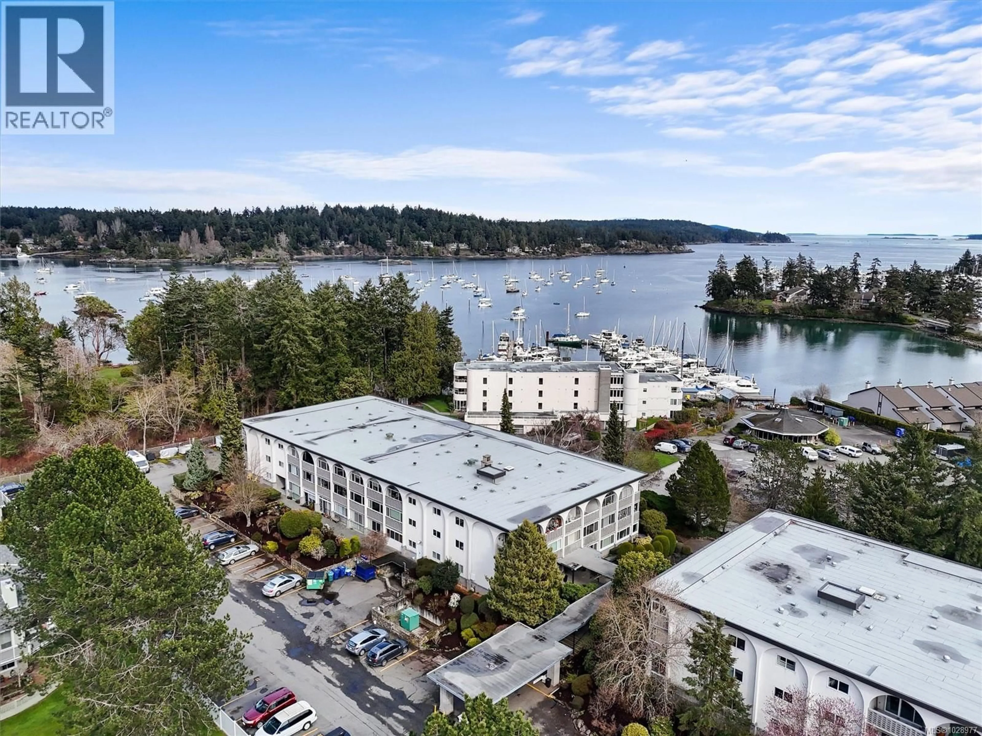 A pic from outside/outdoor area/front of a property/back of a property/a pic from drone, water/lake/river/ocean view for 301 - 2050 WHITE BIRCH ROAD, Sidney British Columbia V8L2R1