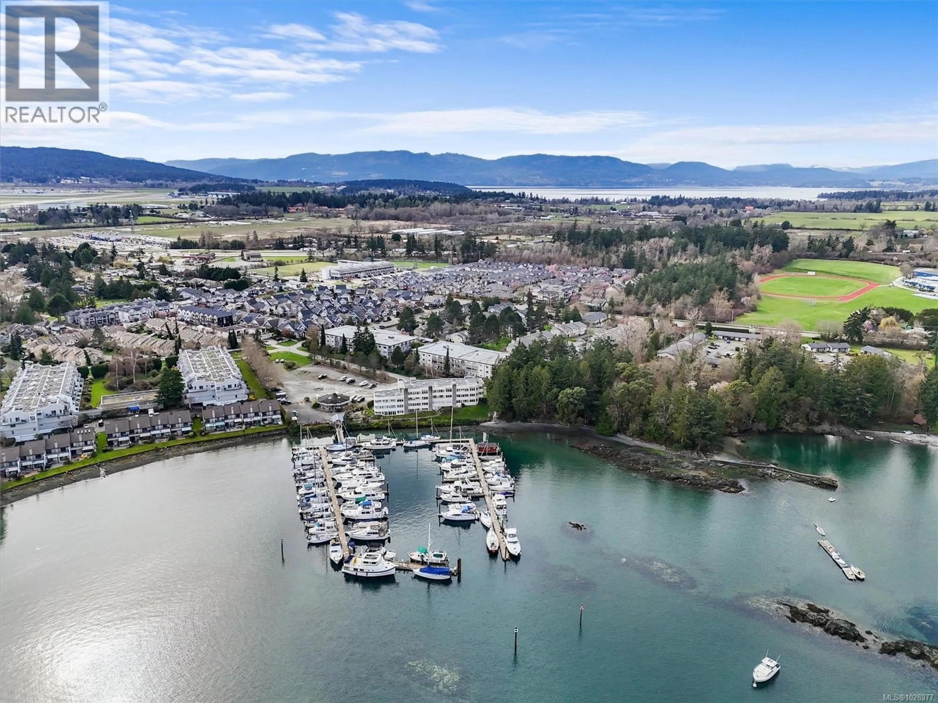 A pic from outside/outdoor area/front of a property/back of a property/a pic from drone, water/lake/river/ocean view for 301 - 2050 WHITE BIRCH ROAD, Sidney British Columbia V8L2R1