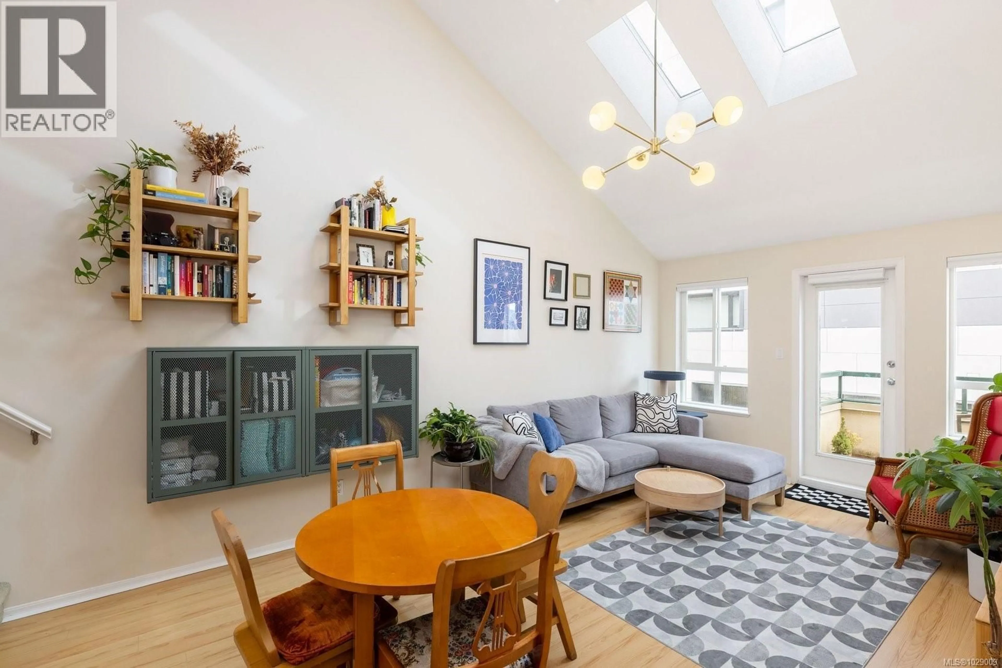 Living room with furniture, wood/laminate floor for 402 - 1015 JOHNSON STREET, Victoria British Columbia V8V3N6