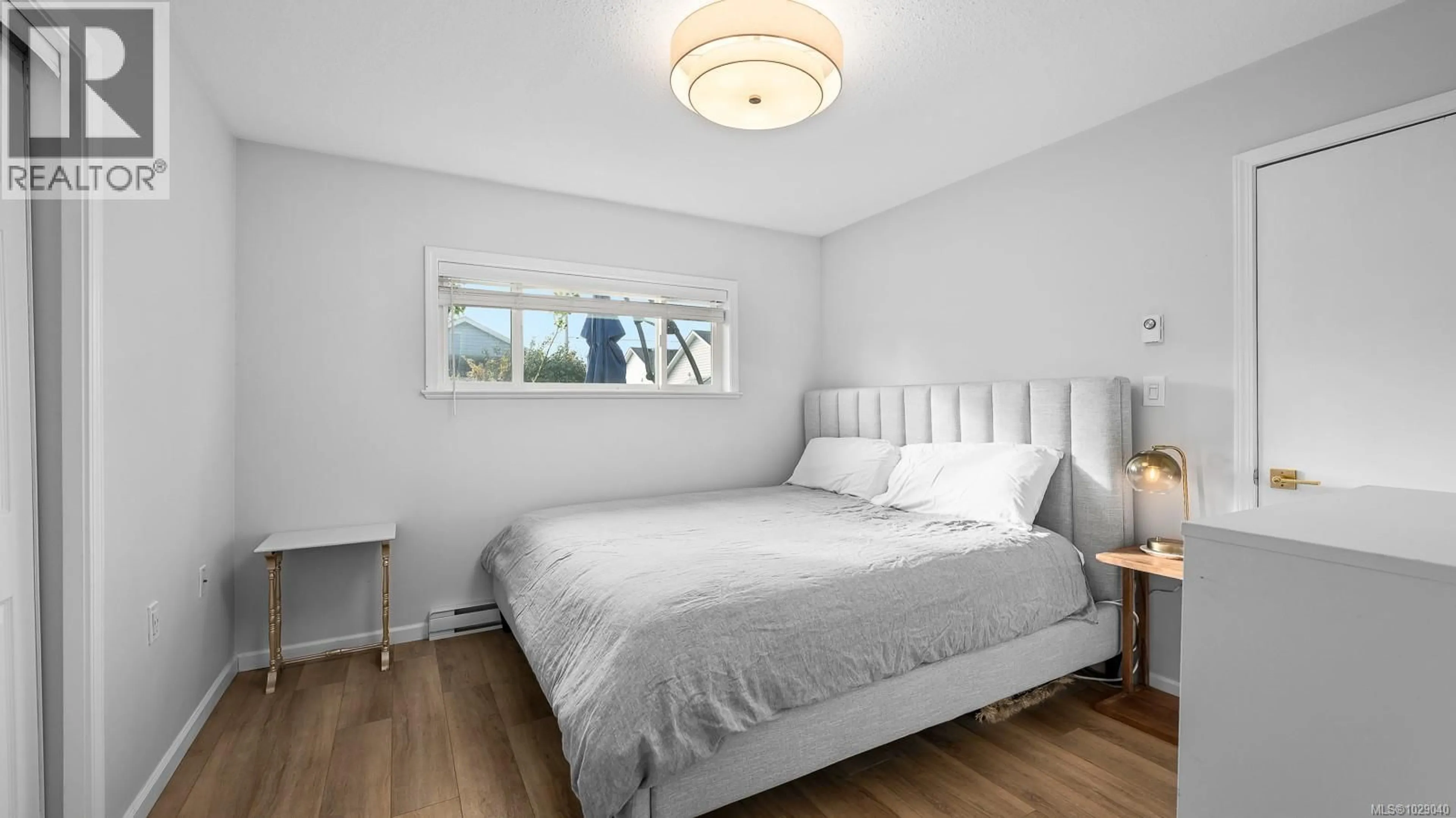 Bedroom with bed, wood/laminate floor for 660 25TH STREET, Courtenay British Columbia V9N8J3