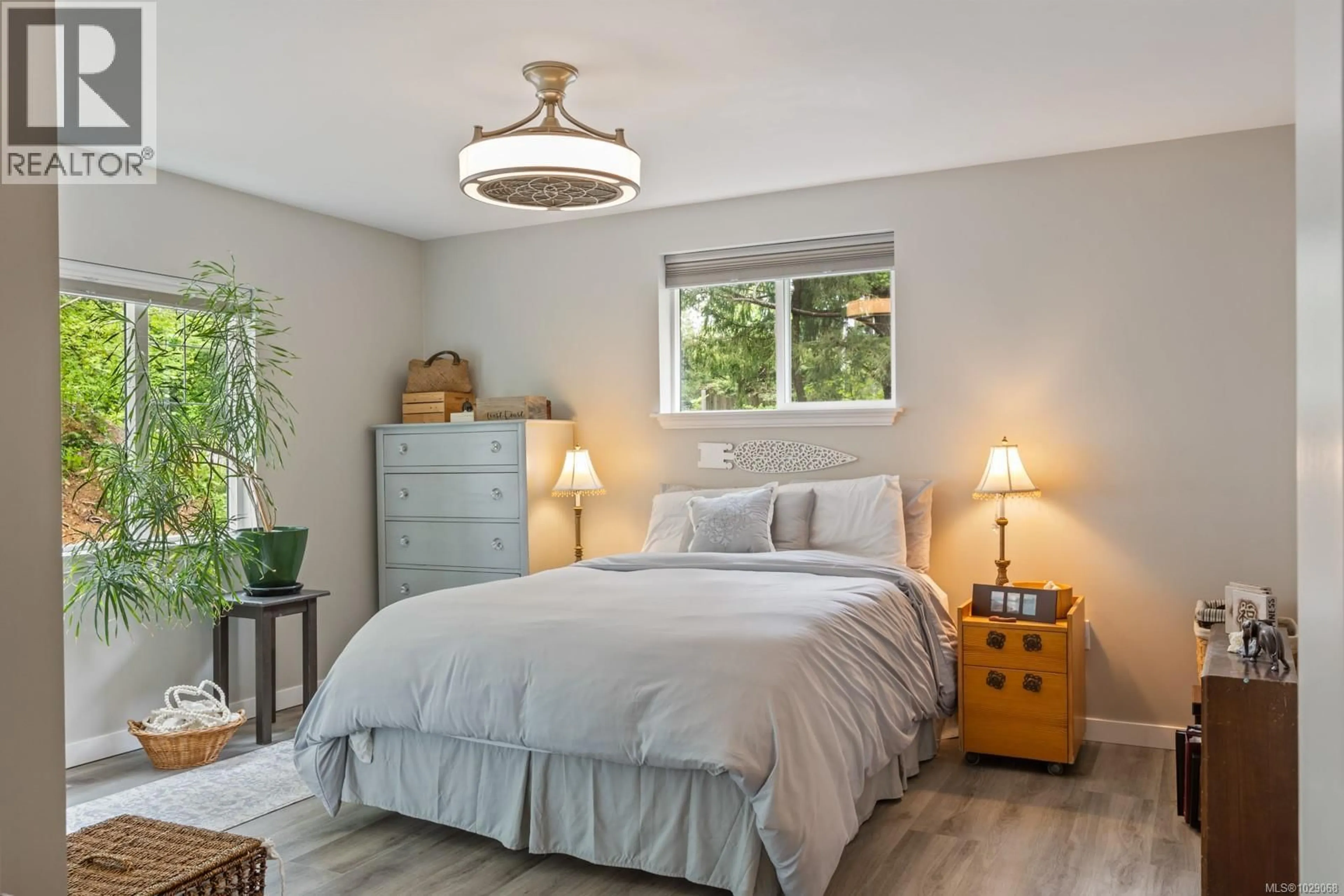 Bedroom with bed, wood/laminate floor for 3671 THOMSON ROAD, Courtenay British Columbia V9N9T5