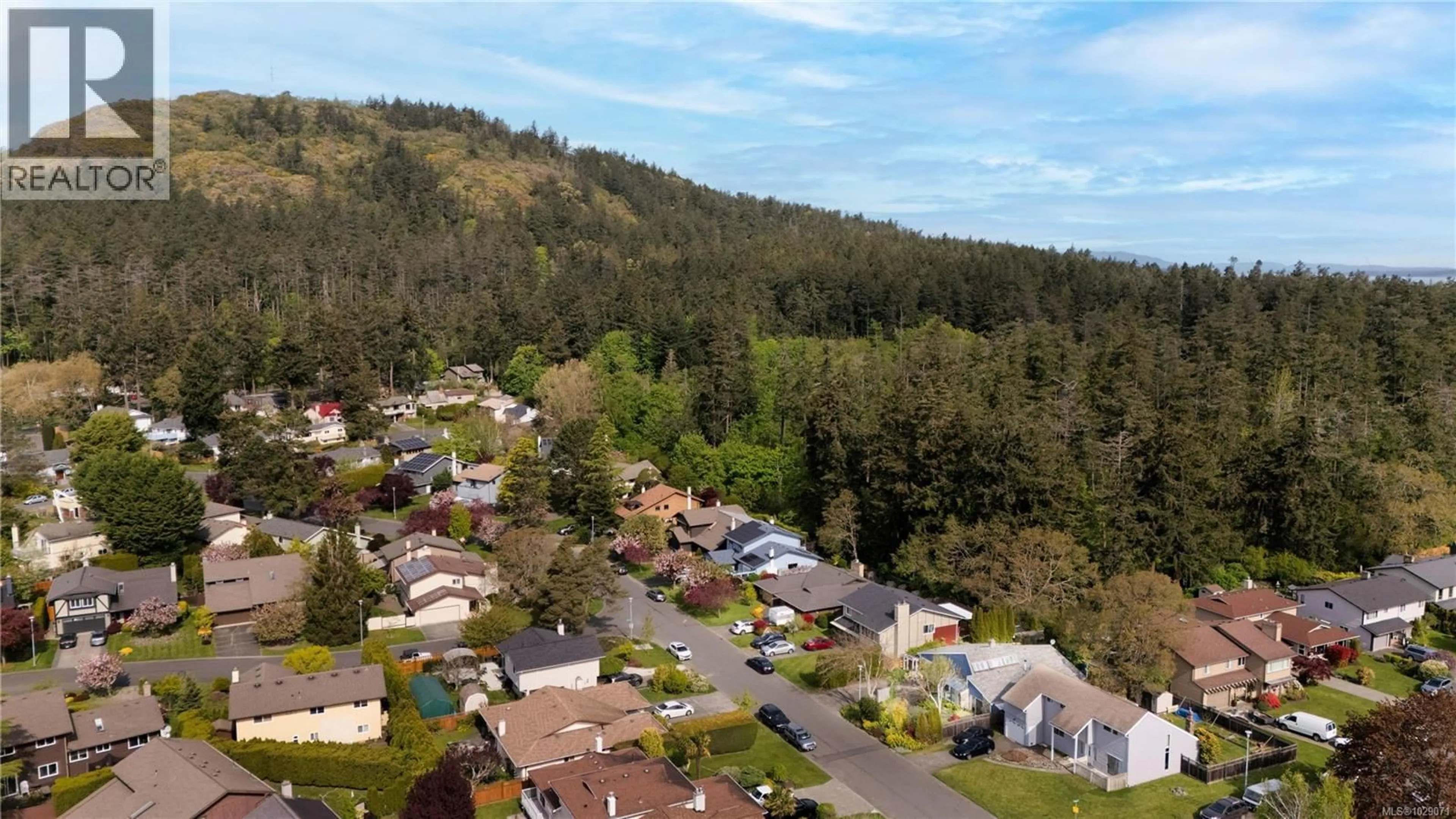A pic from outside/outdoor area/front of a property/back of a property/a pic from drone, mountain view for 4395 ROBINWOOD DRIVE, Saanich British Columbia V8N5R7