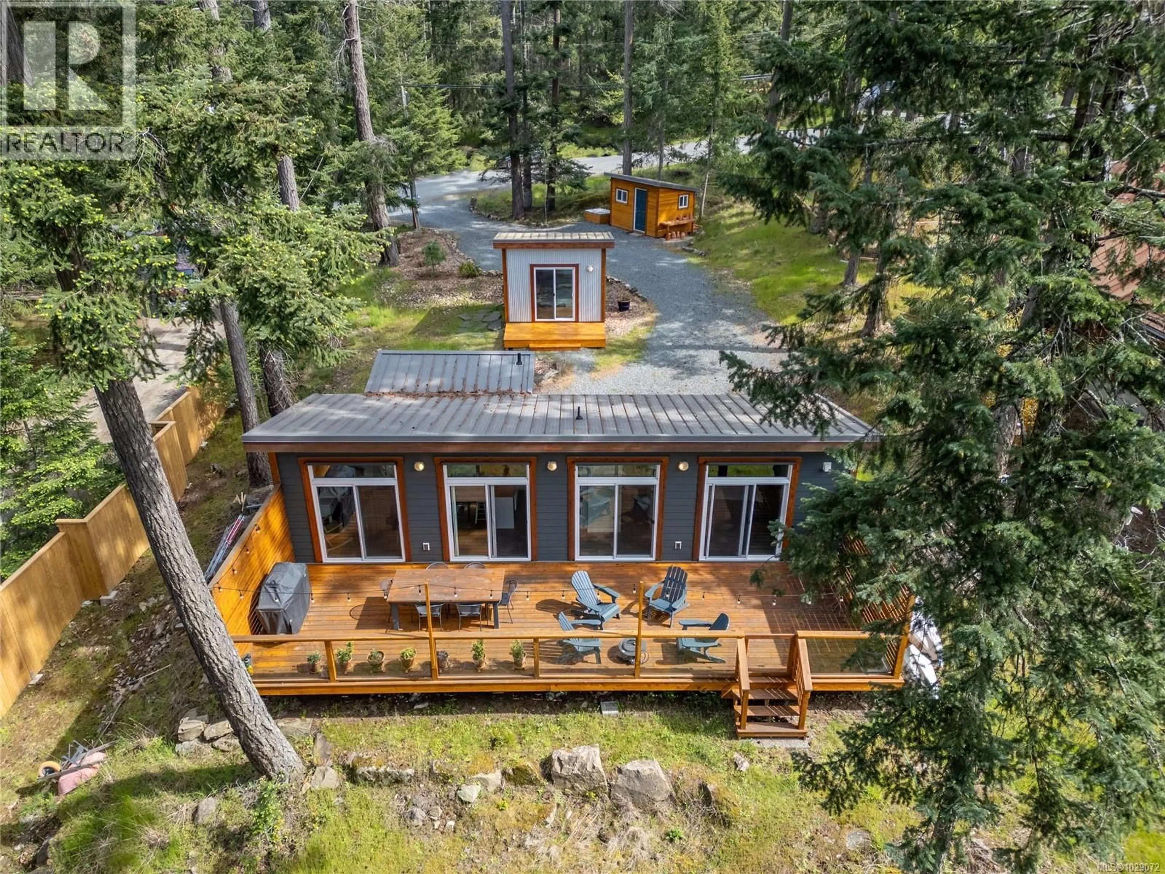 A pic from outside/outdoor area/front of a property/back of a property/a pic from drone, forest/trees view for 3755 PRIVATEERS ROAD, Pender Island British Columbia V0N2M0