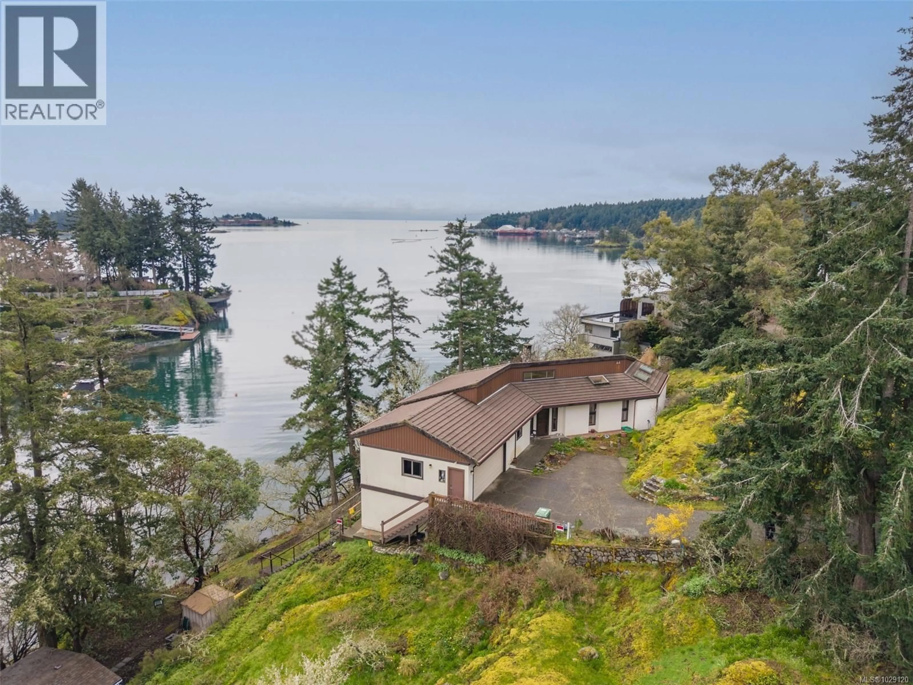 A pic from outside/outdoor area/front of a property/back of a property/a pic from drone, water/lake/river/ocean view for 312 BESSBOROUGH AVENUE, View Royal British Columbia V9B1T7