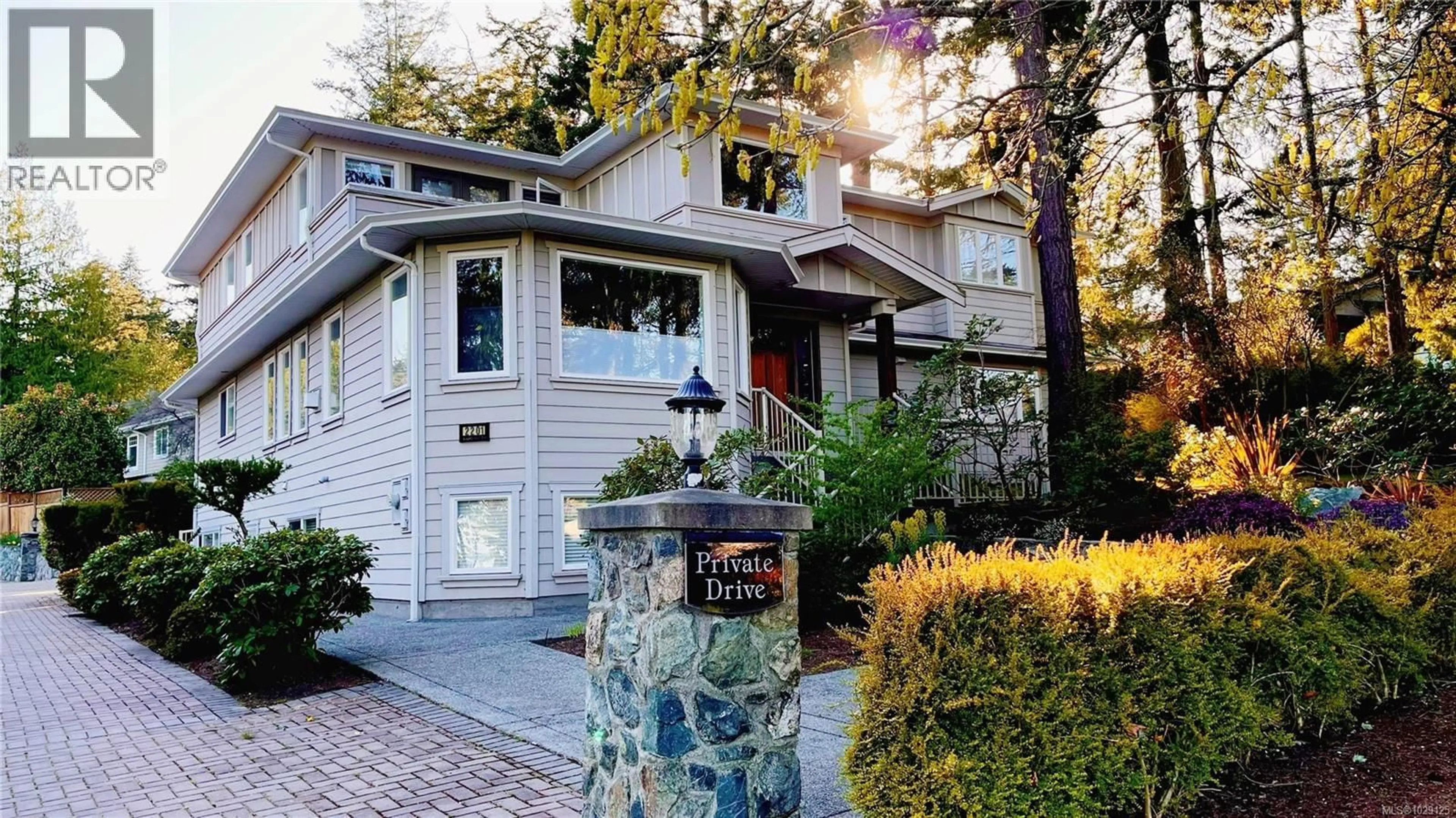 Home with vinyl exterior material, street for 2201 ARBUTUS COVE LANE, Saanich British Columbia V8N6N7