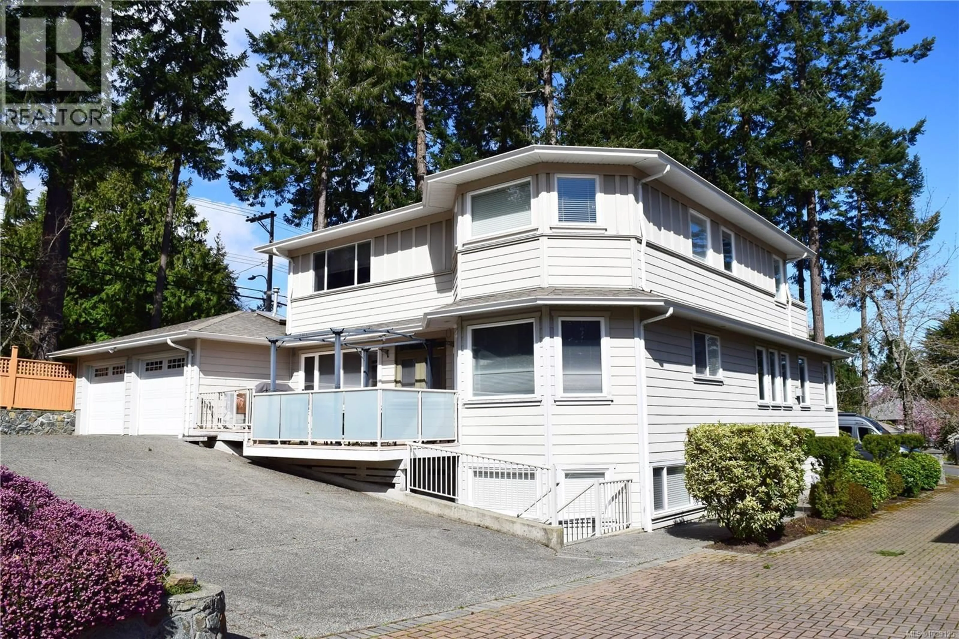 Home with vinyl exterior material, street for 2201 ARBUTUS COVE LANE, Saanich British Columbia V8N6N7