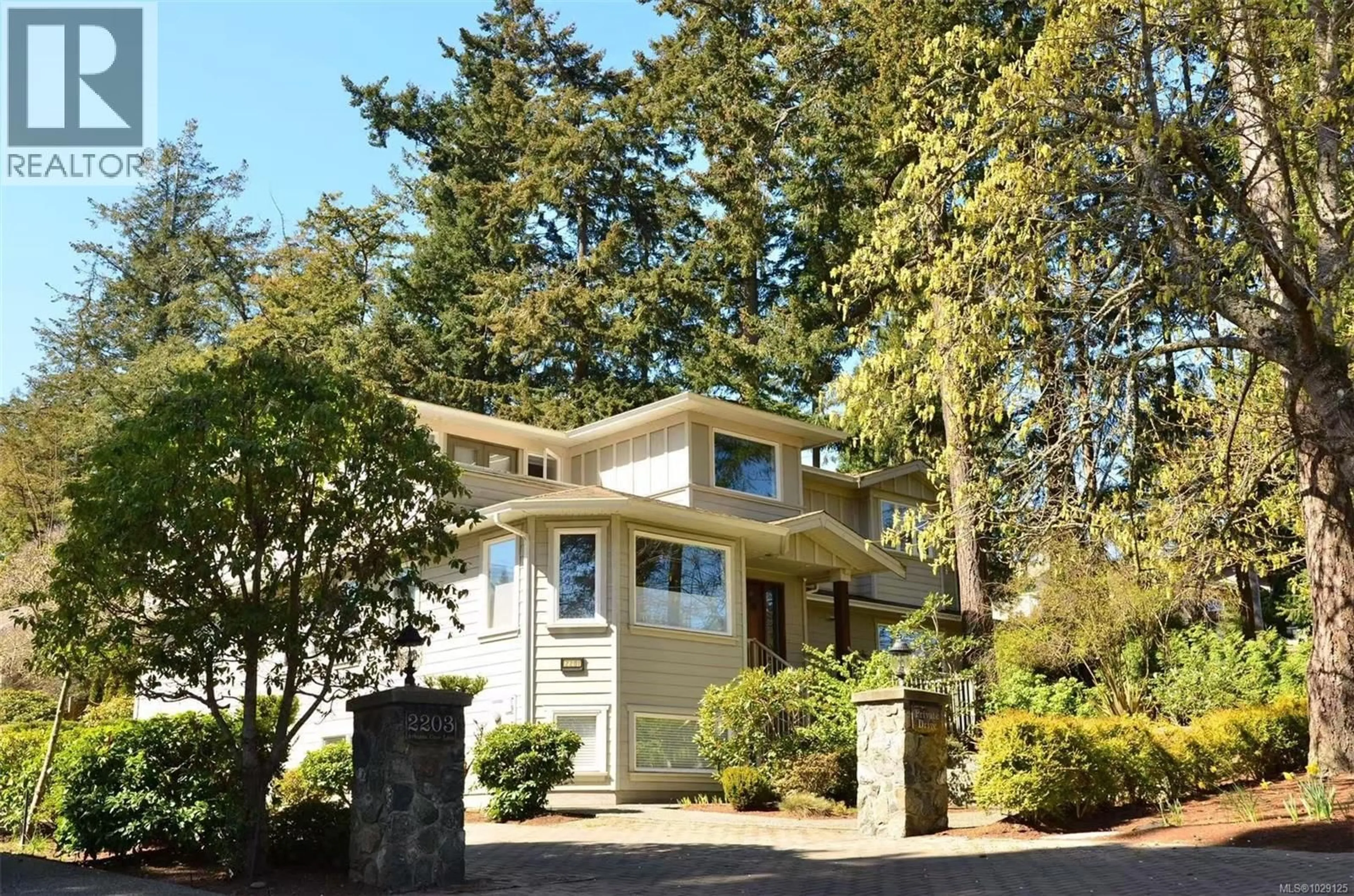 Home with vinyl exterior material, street for 2201 ARBUTUS COVE LANE, Saanich British Columbia V8N6N7