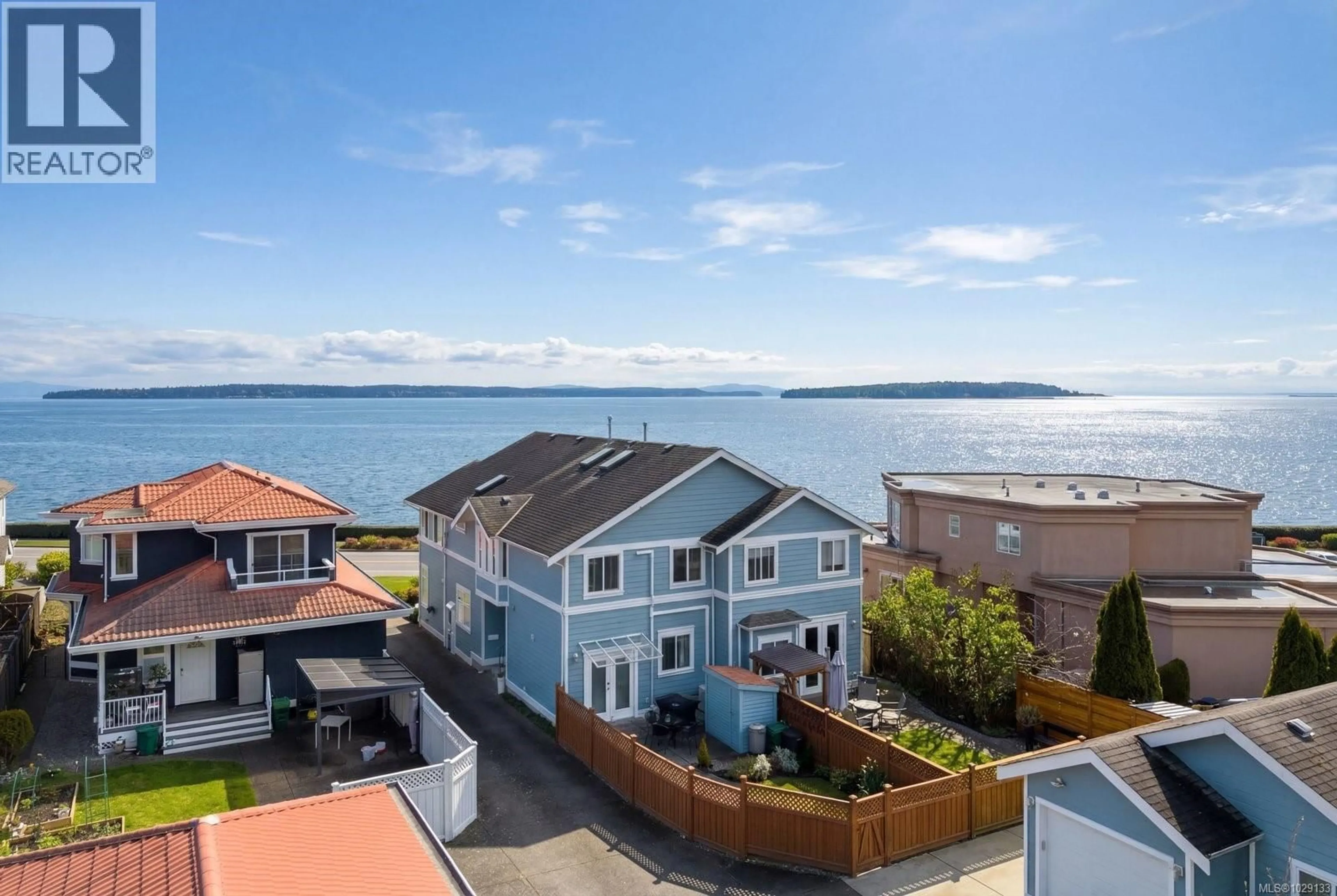 A pic from outside/outdoor area/front of a property/back of a property/a pic from drone, water/lake/river/ocean view for 9452 LOCHSIDE DRIVE, Sidney British Columbia V8L1N8