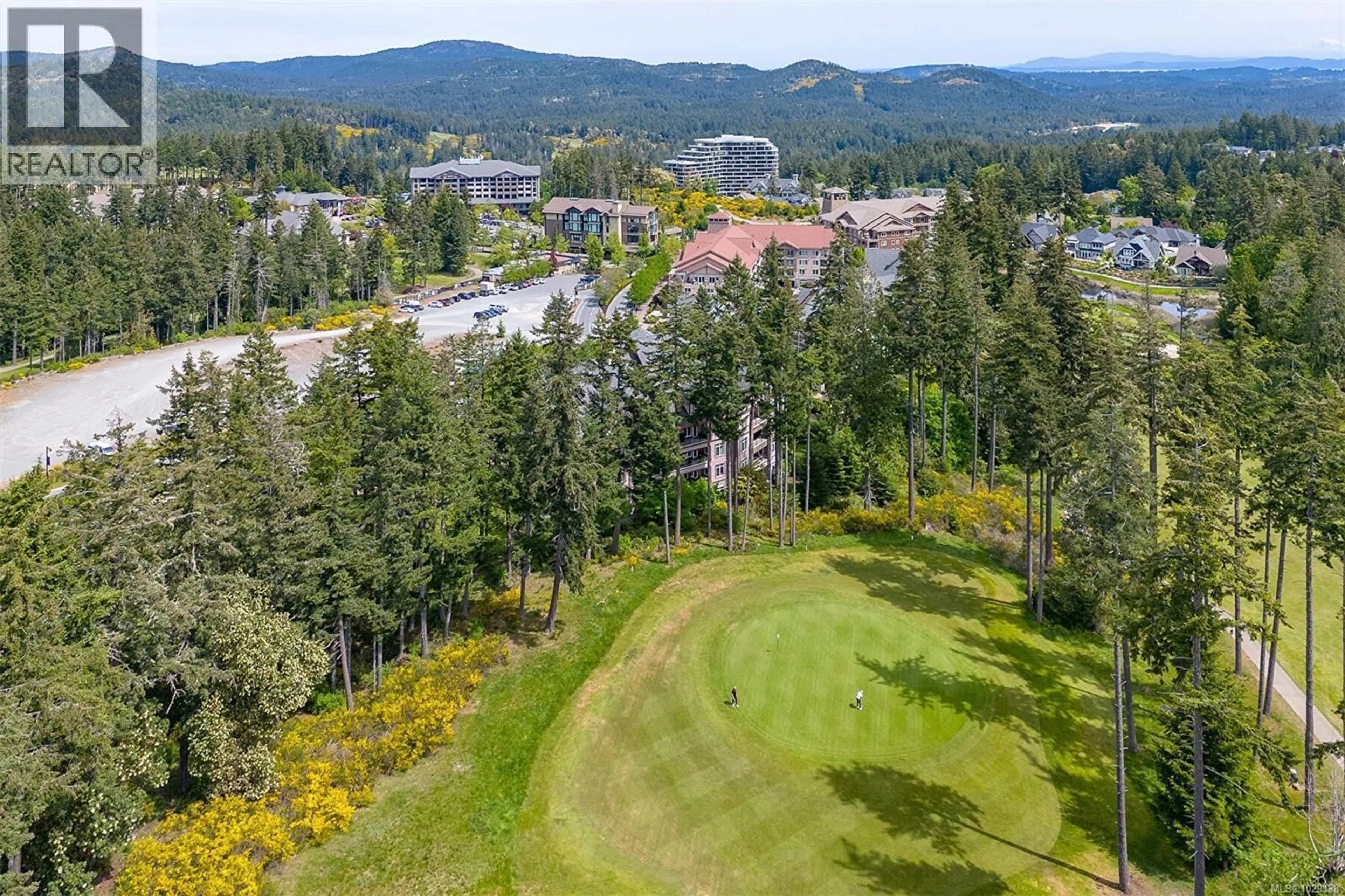 A pic from outside/outdoor area/front of a property/back of a property/a pic from drone, forest/trees view for 210/212 - 1395 BEAR MOUNTAIN PARKWAY, Langford British Columbia V9B0E1