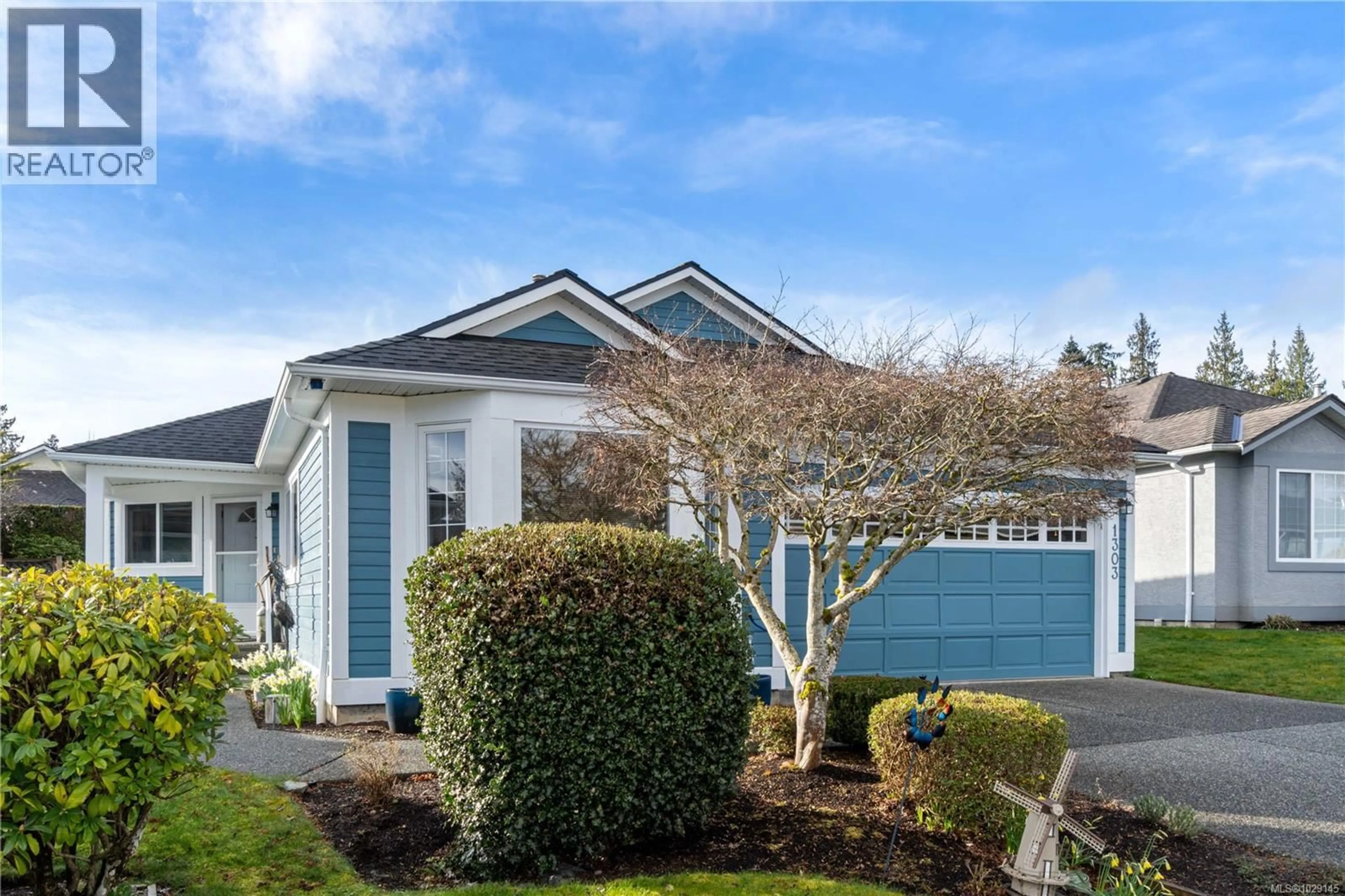 Home with vinyl exterior material, street for 1303 OCEANSIDE DRIVE, Qualicum Beach British Columbia V9K2K4