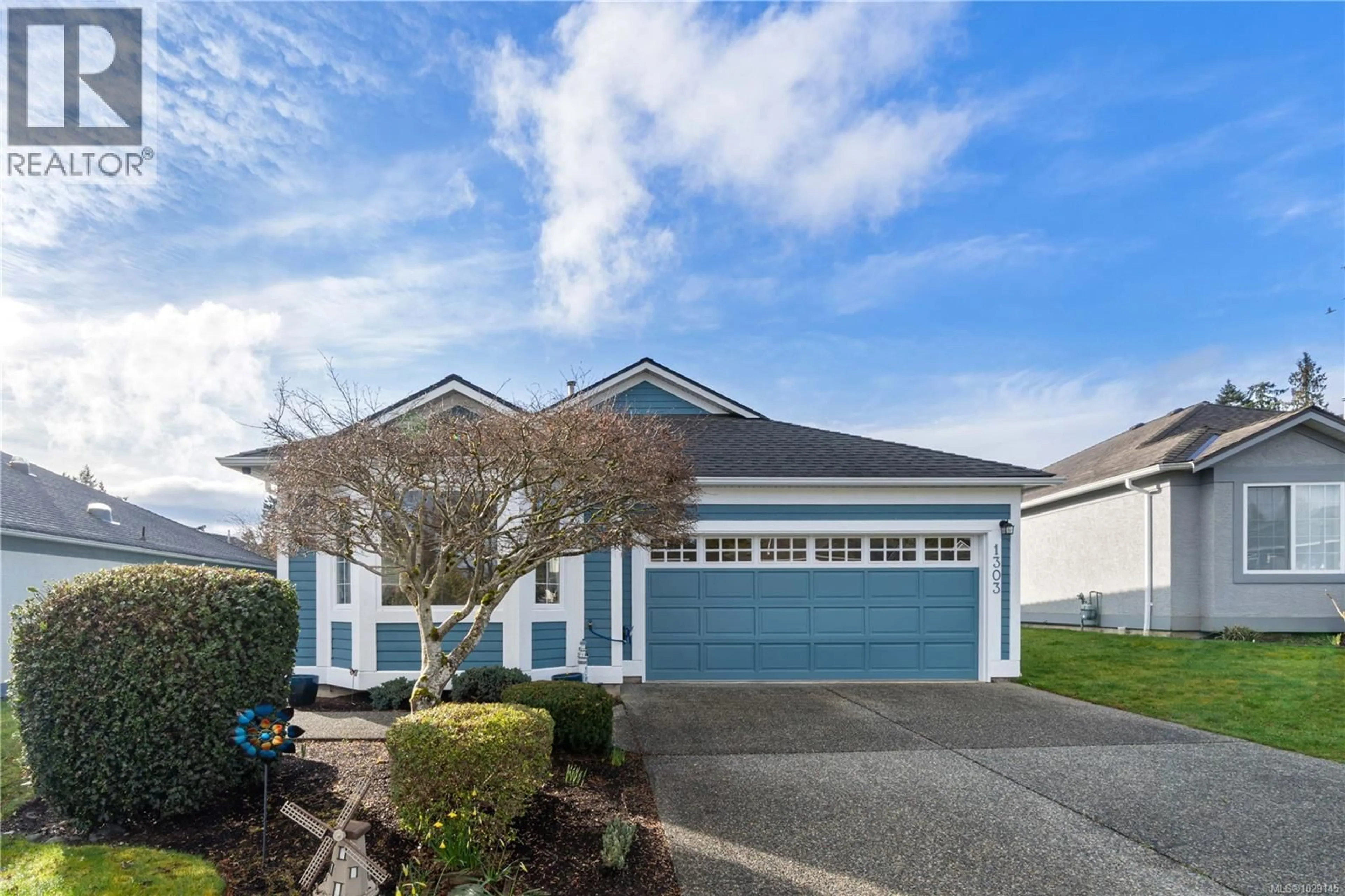 Home with vinyl exterior material, street for 1303 OCEANSIDE DRIVE, Qualicum Beach British Columbia V9K2K4