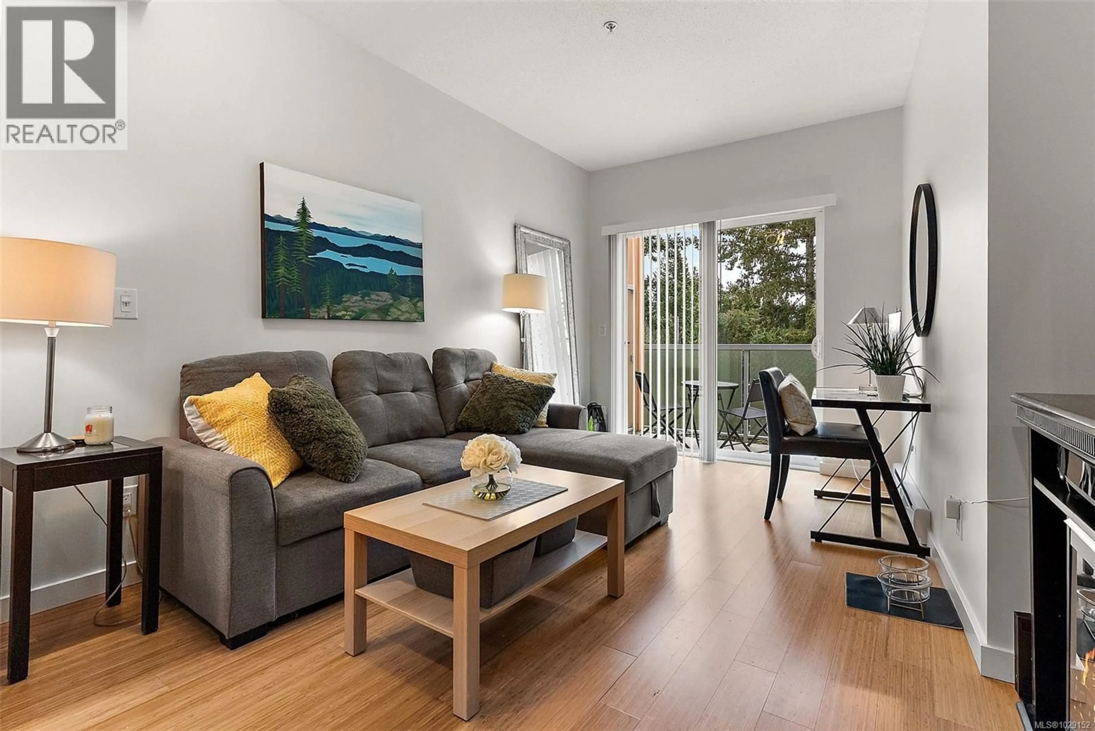 Living room with furniture, wood/laminate floor for 414 - 611 BROOKSIDE ROAD, Colwood British Columbia V9C0C3