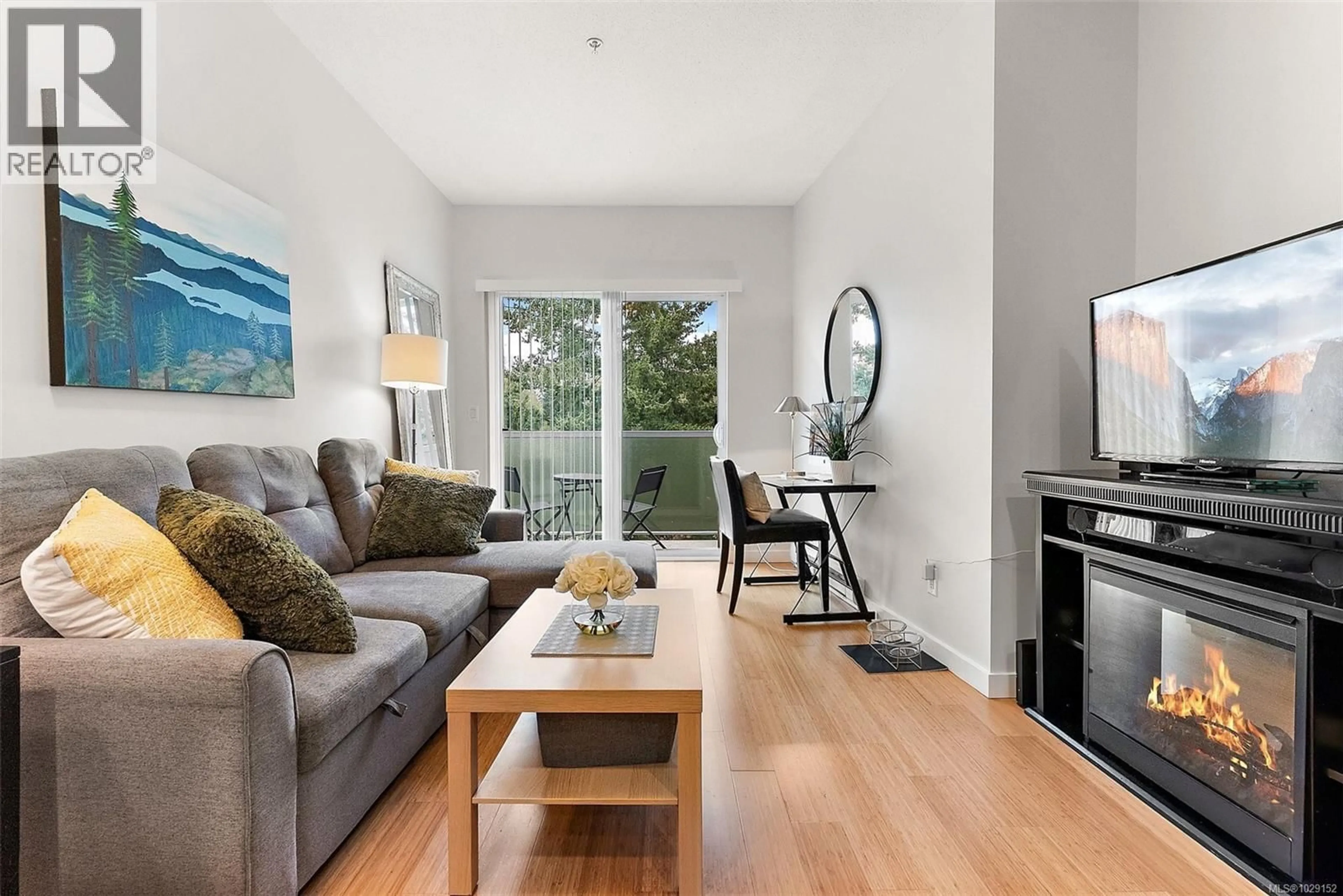 Living room with furniture, wood/laminate floor for 414 - 611 BROOKSIDE ROAD, Colwood British Columbia V9C0C3