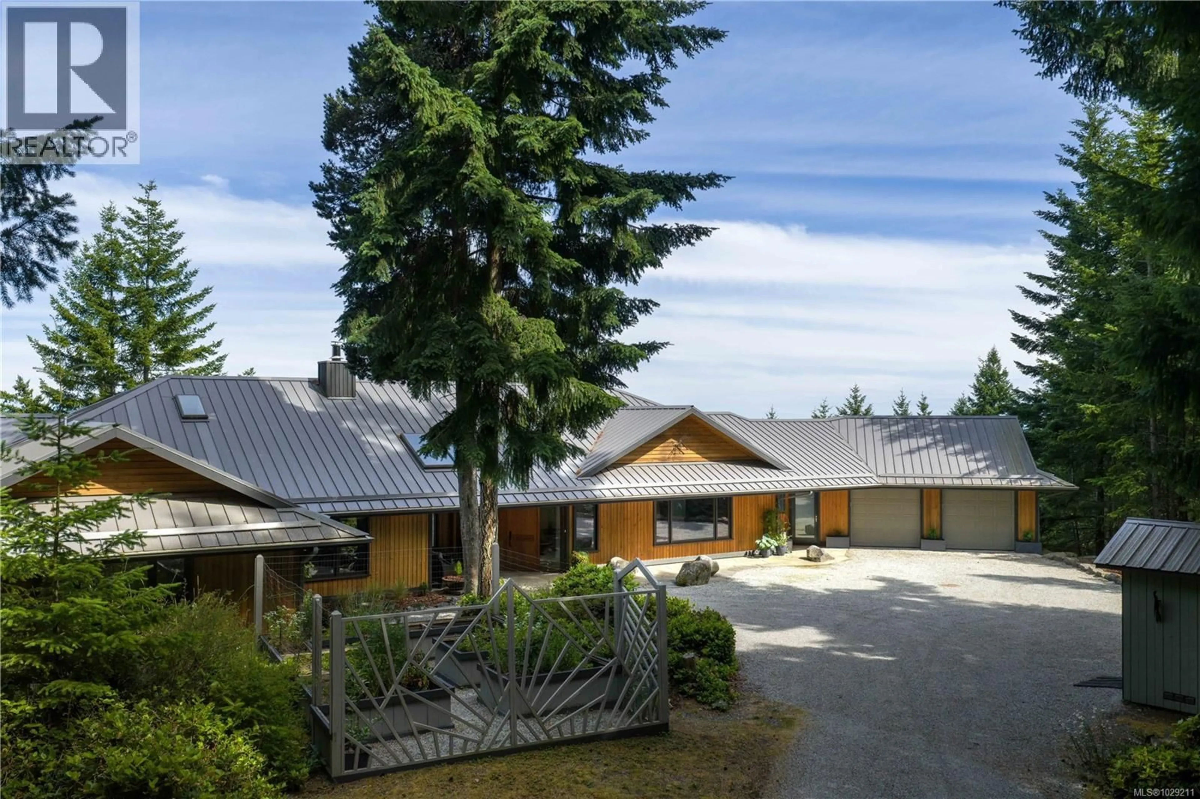 A pic from outside/outdoor area/front of a property/back of a property/a pic from drone, mountain view for 253 CHILTON ROAD, Salt Spring British Columbia V8K2W9