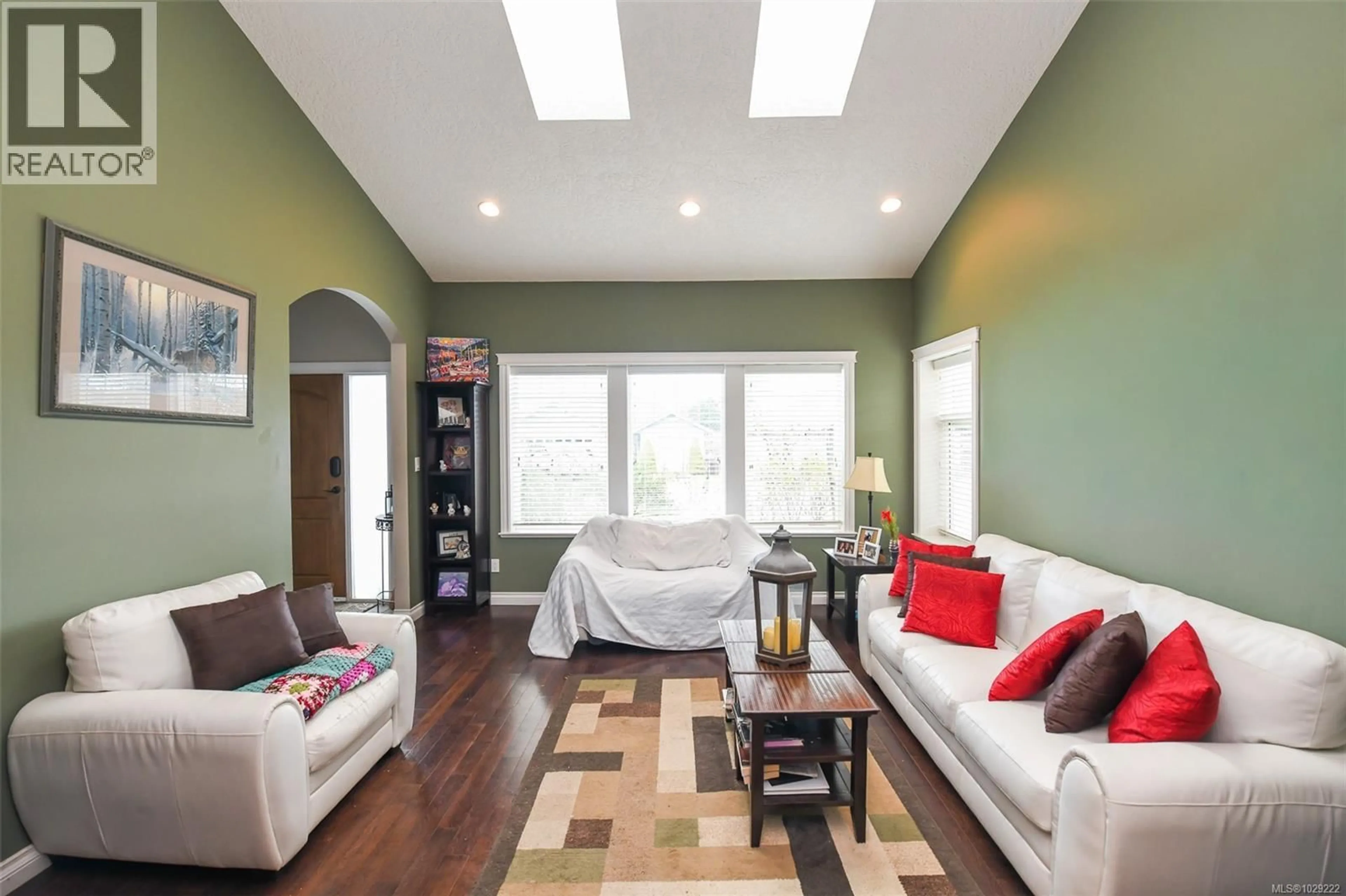 Living room with furniture, wood/laminate floor for 2737 KENDAL AVENUE, Cumberland British Columbia V0R1S0