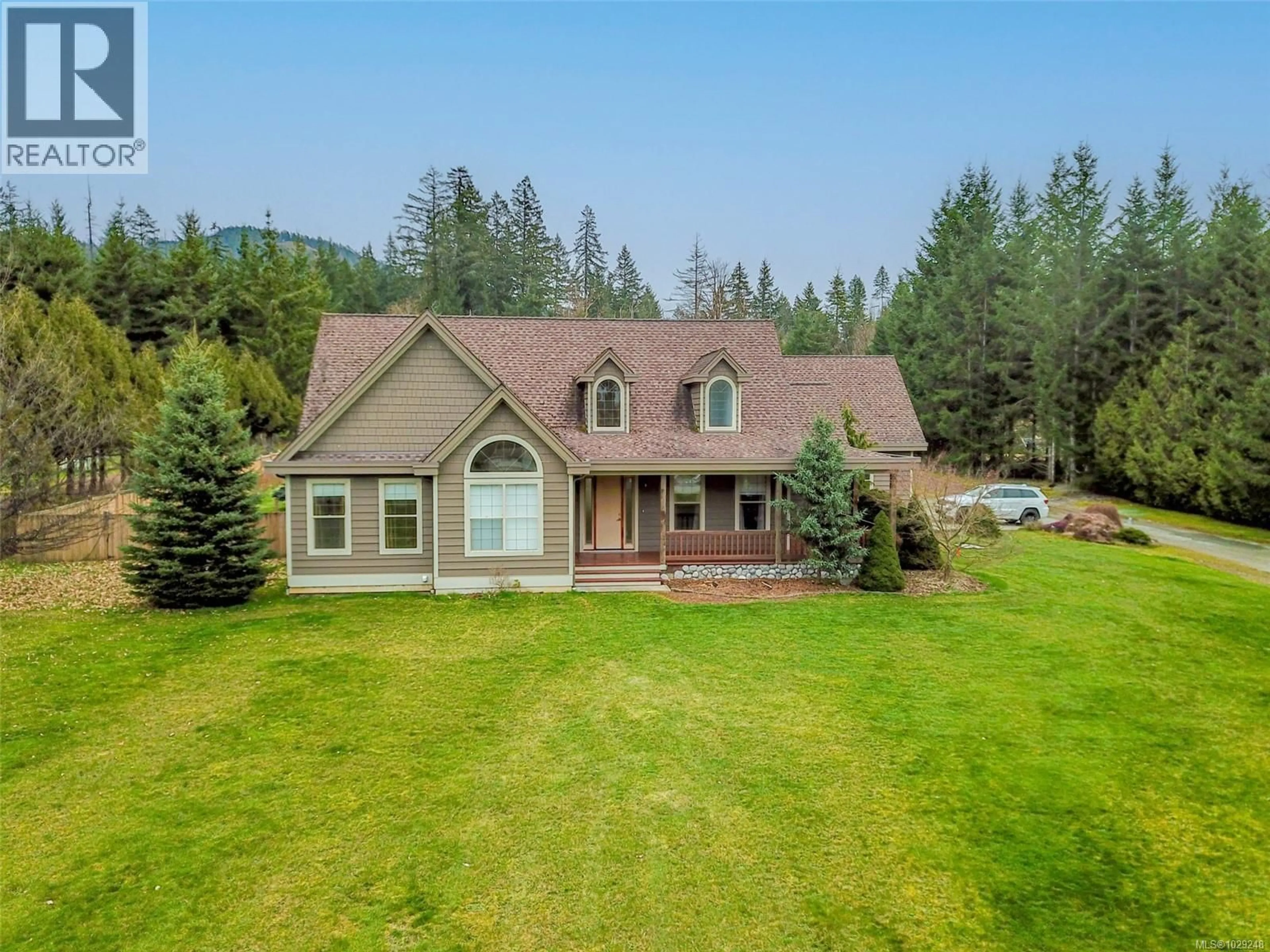 A pic from outside/outdoor area/front of a property/back of a property/a pic from drone, mountain view for 5495 MAEBELLE ROAD, Port Alberni British Columbia V9Y8R2