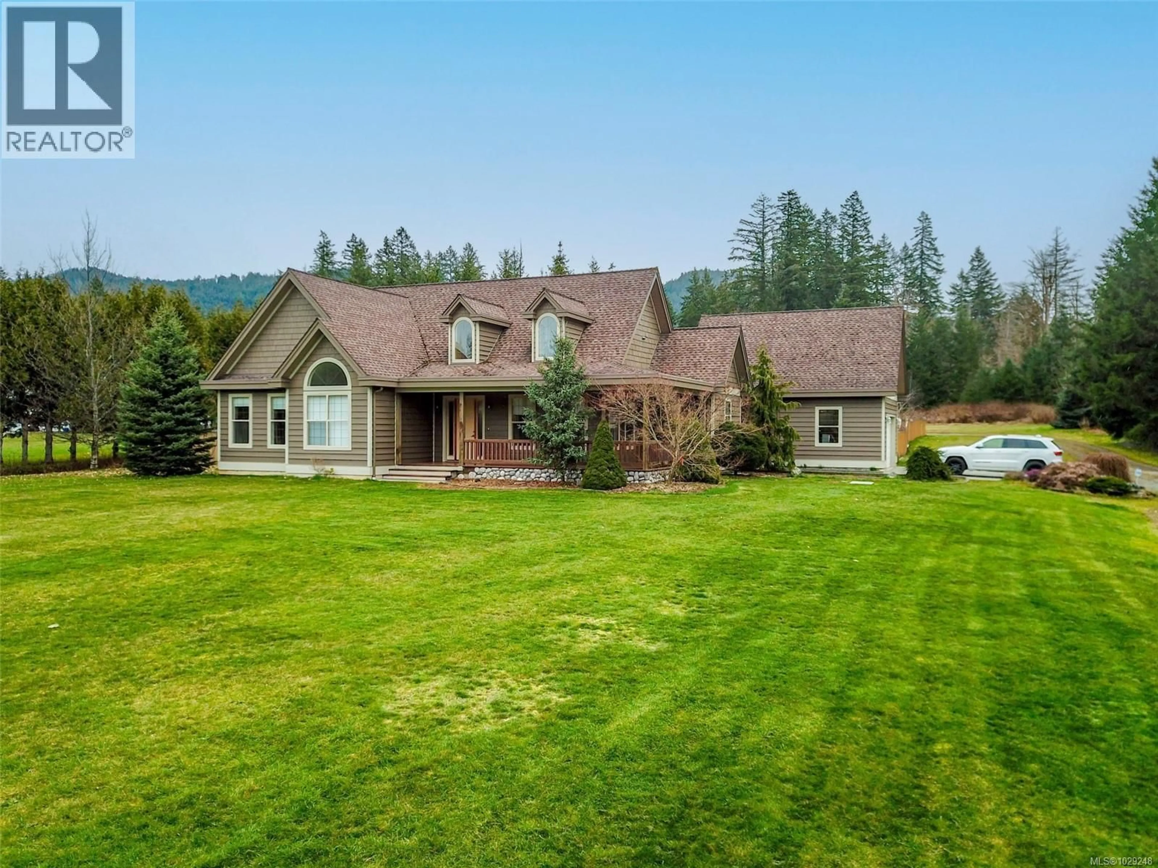 A pic from outside/outdoor area/front of a property/back of a property/a pic from drone, mountain view for 5495 MAEBELLE ROAD, Port Alberni British Columbia V9Y8R2