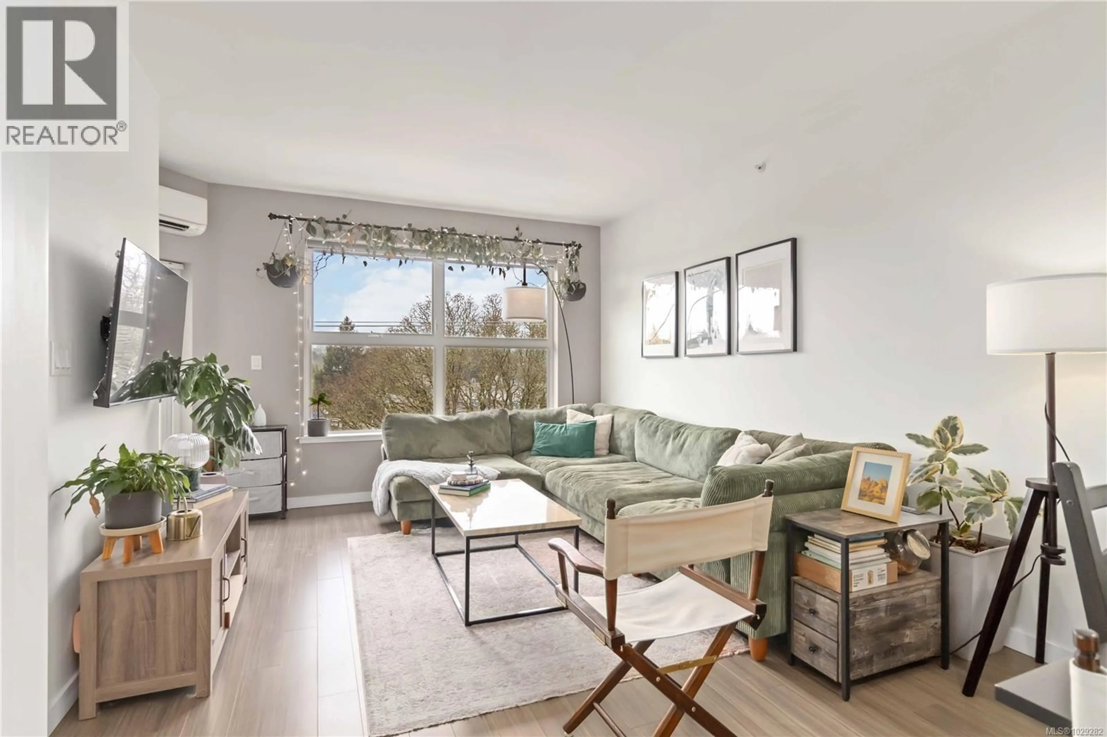 Living room with furniture, wood/laminate floor for 420 - 2871 JACKLIN ROAD, Langford British Columbia V9B5R8