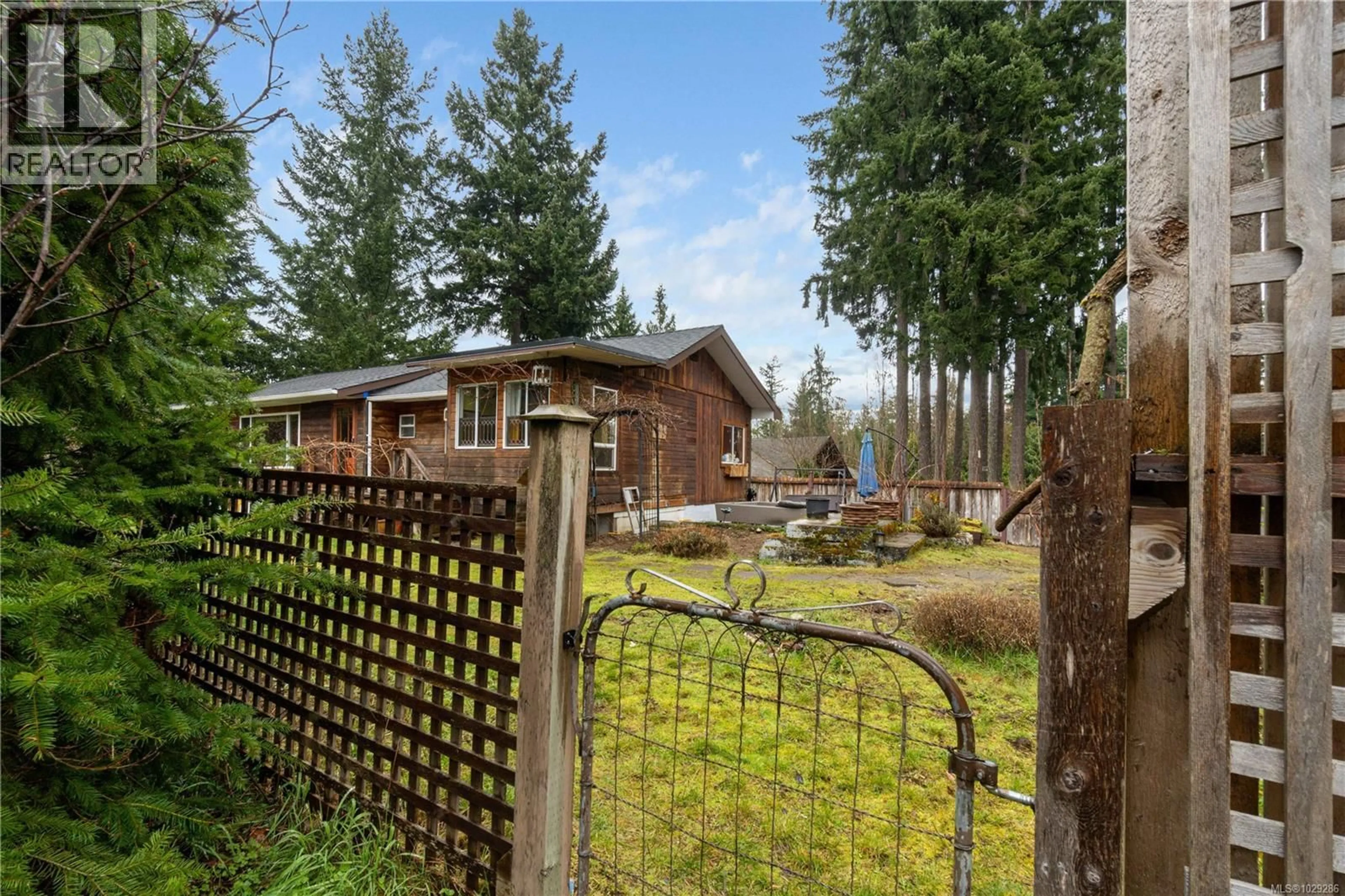 A pic from outside/outdoor area/front of a property/back of a property/a pic from drone, forest/trees view for 980 POPLAR WAY, Whiskey Creek British Columbia V9K1X9
