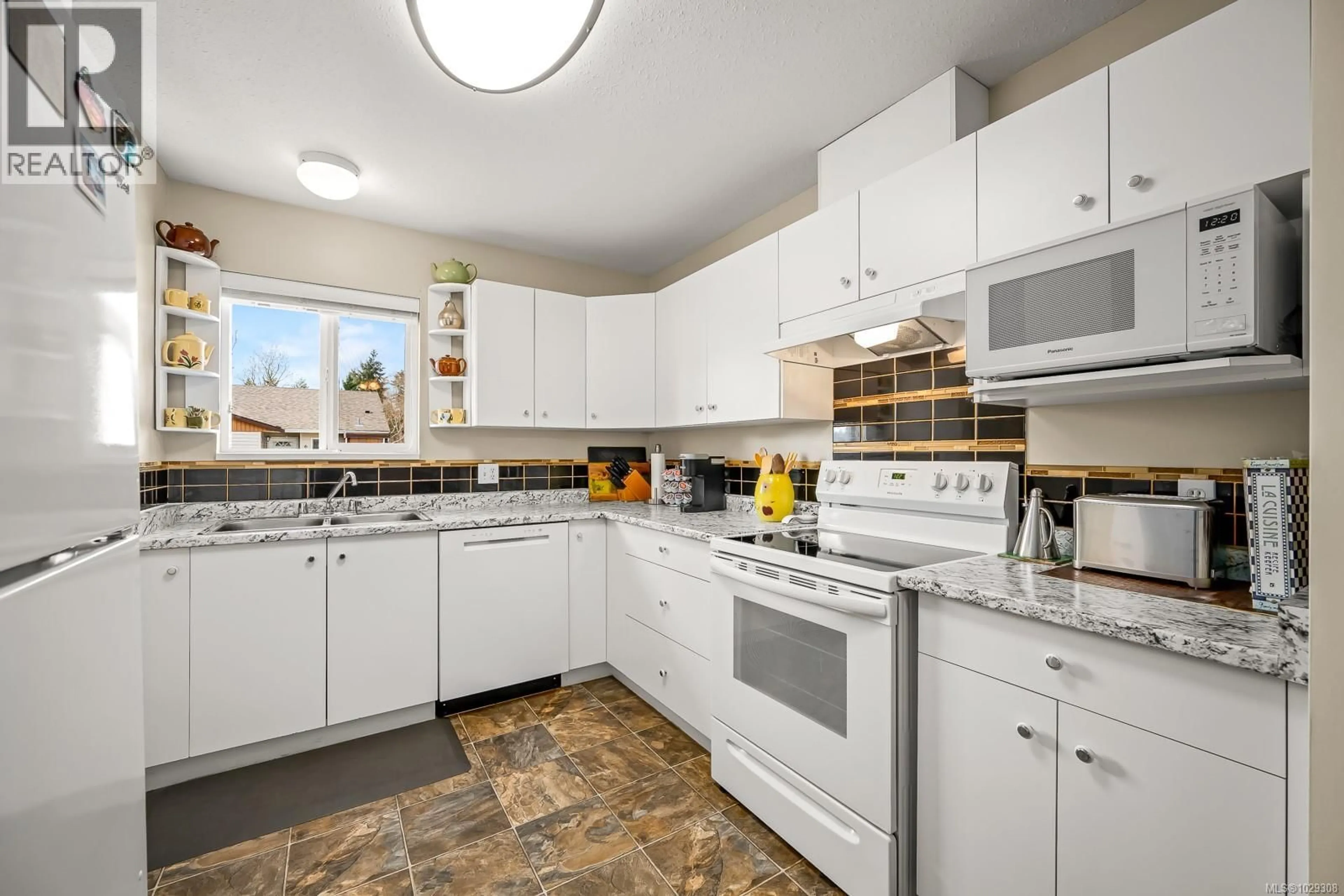 Standard kitchen, ceramic/tile floor for 3 - 2197 MURRELET DRIVE, Comox British Columbia V9M3Y1