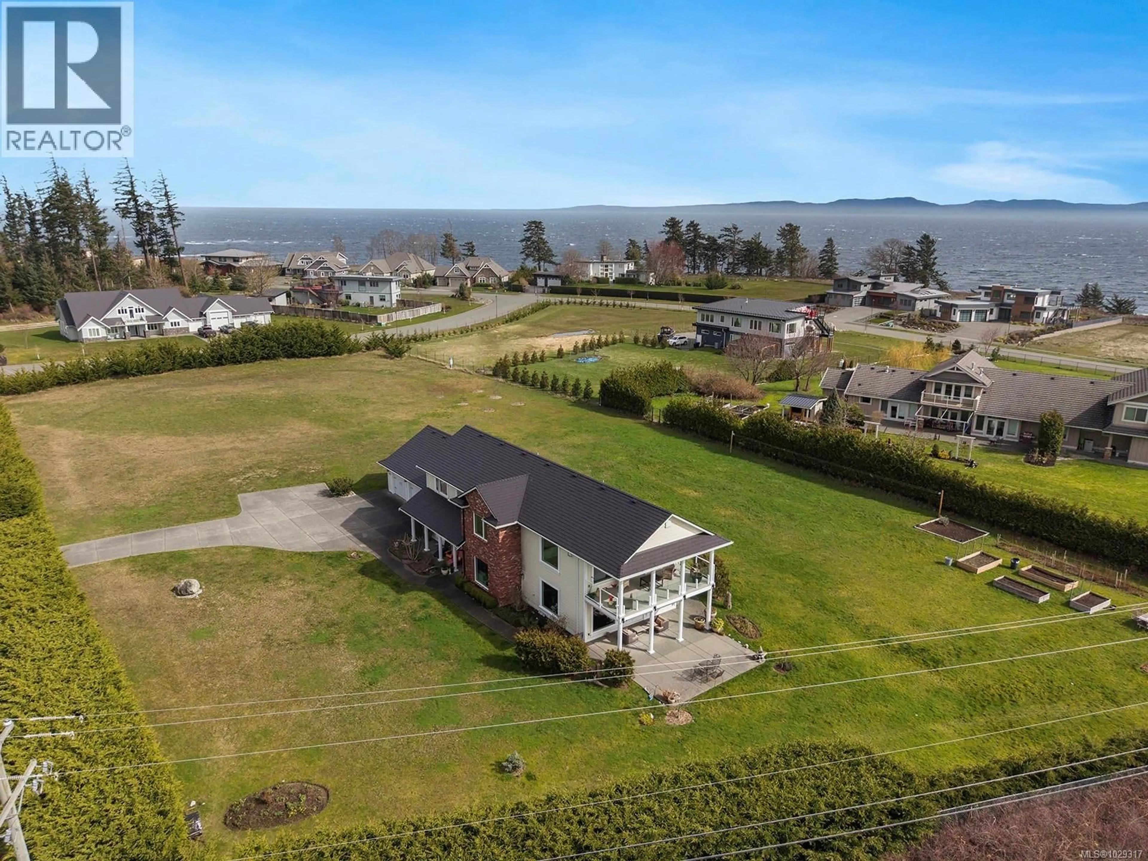 A pic from outside/outdoor area/front of a property/back of a property/a pic from drone, water/lake/river/ocean view for 1167 TARA ROAD, Comox British Columbia V9M3T5