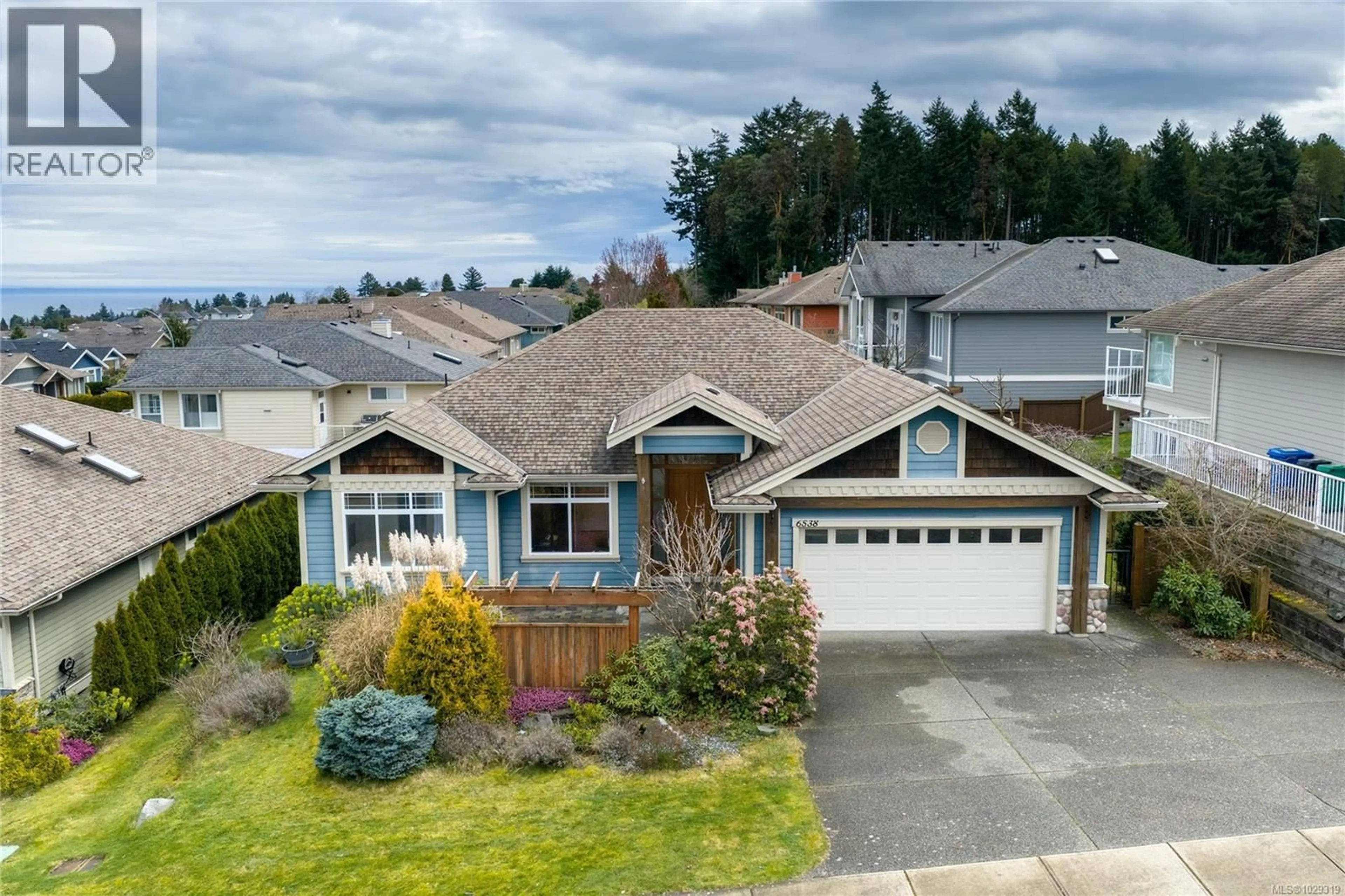 A pic from outside/outdoor area/front of a property/back of a property/a pic from drone, street for 6538 HARRIER ROAD, Nanaimo British Columbia V9V1V8
