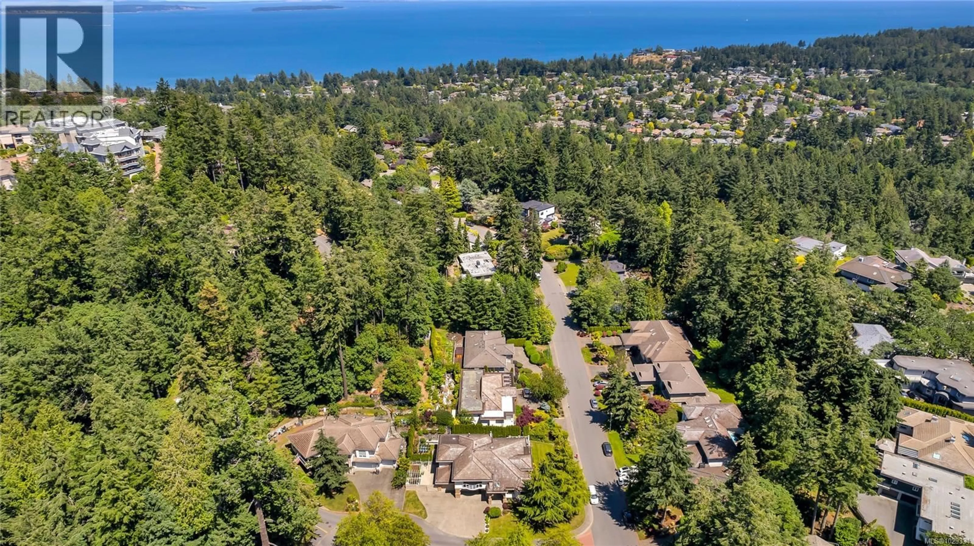 A pic from outside/outdoor area/front of a property/back of a property/a pic from drone, water/lake/river/ocean view for 948 BOULDERWOOD RISE, Saanich British Columbia V8Y3G5