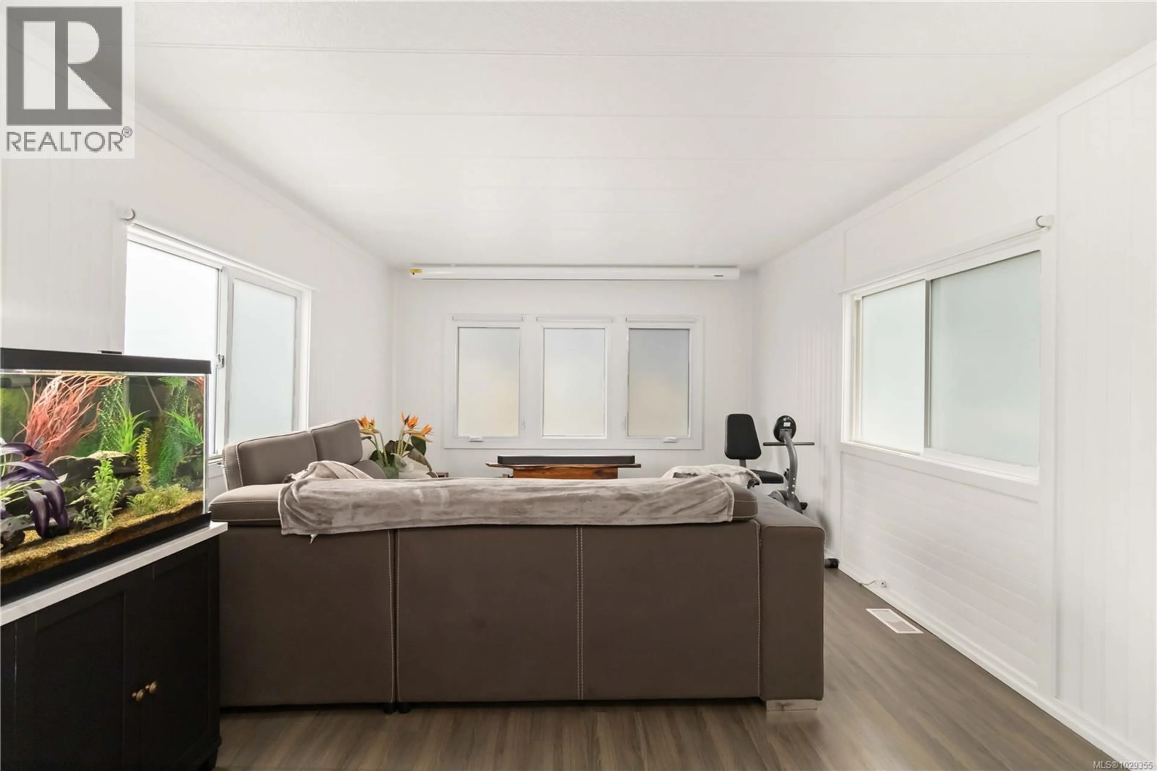 Living room with furniture, wood/laminate floor for 52 - 2817 SOOKE LAKE ROAD, Langford British Columbia V9B4P9