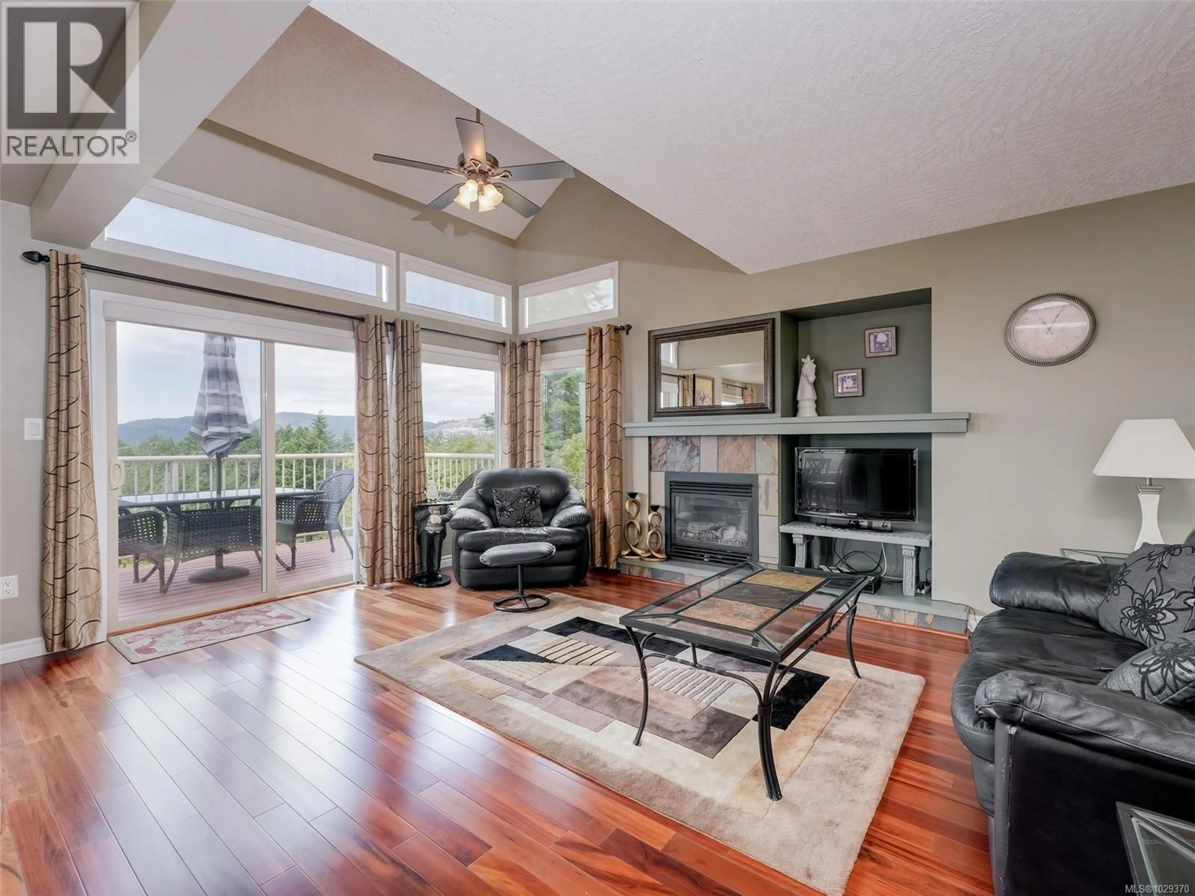 Living room with furniture, wood/laminate floor for 641 OLYMPIA RIDGE, Langford British Columbia V9B6N9