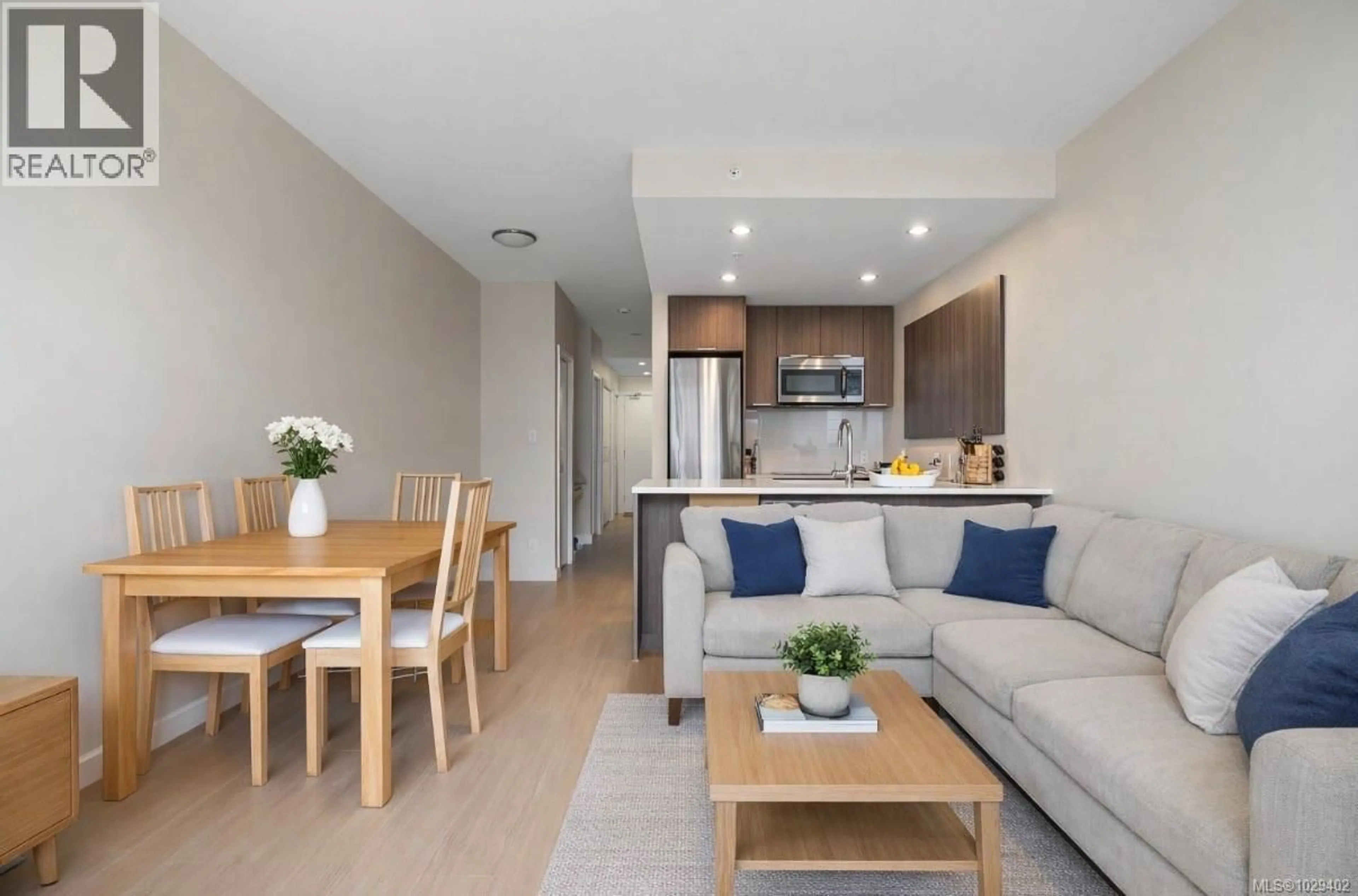 Living room with furniture, wood/laminate floor for 610 - 728 YATES STREET, Victoria British Columbia V8W0C8