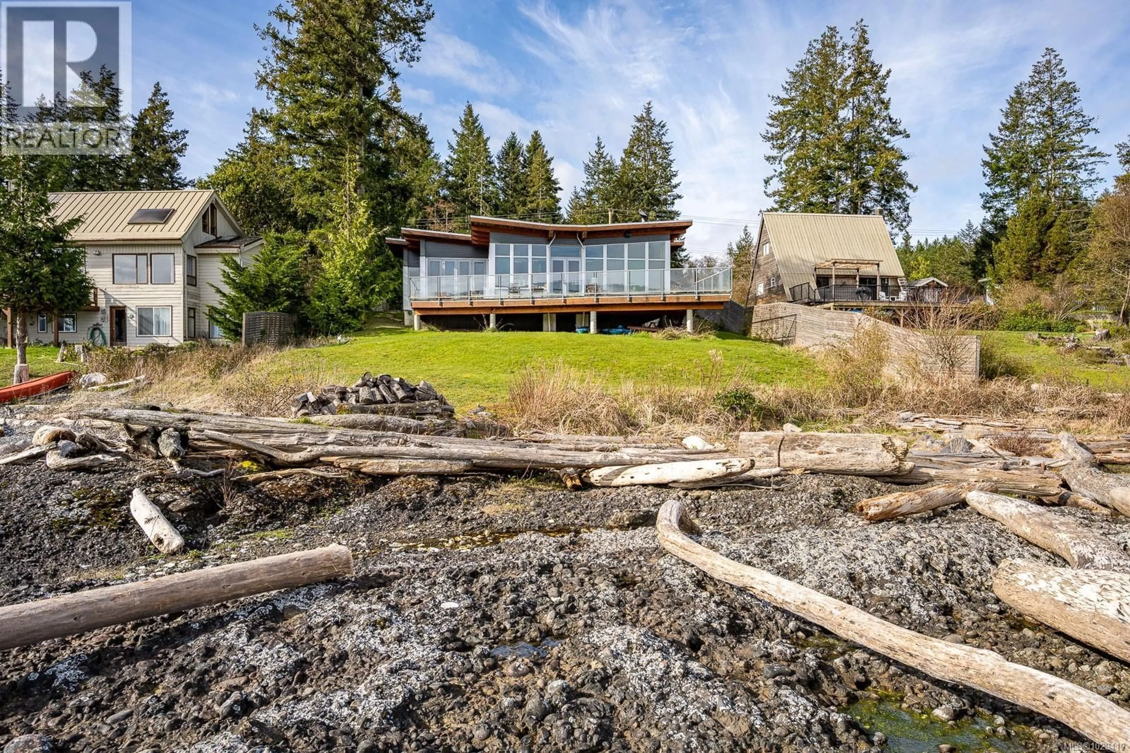 A pic from outside/outdoor area/front of a property/back of a property/a pic from drone, water/lake/river/ocean view for 3870 EAST ROAD, Denman Island British Columbia V0R1T0
