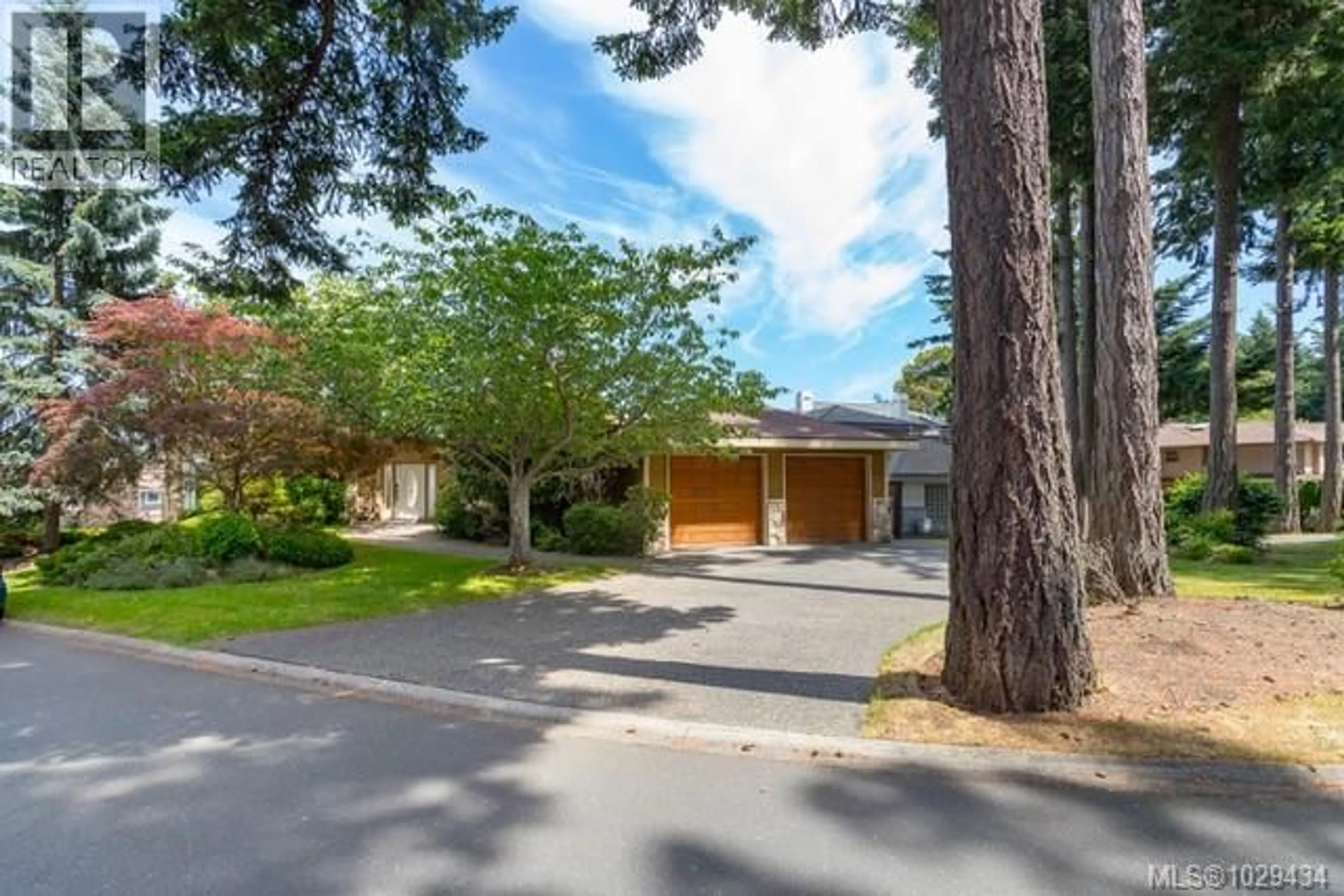 A pic from outside/outdoor area/front of a property/back of a property/a pic from drone, street for 4405 MOONLIGHT LANE, Saanich British Columbia V8N6K7