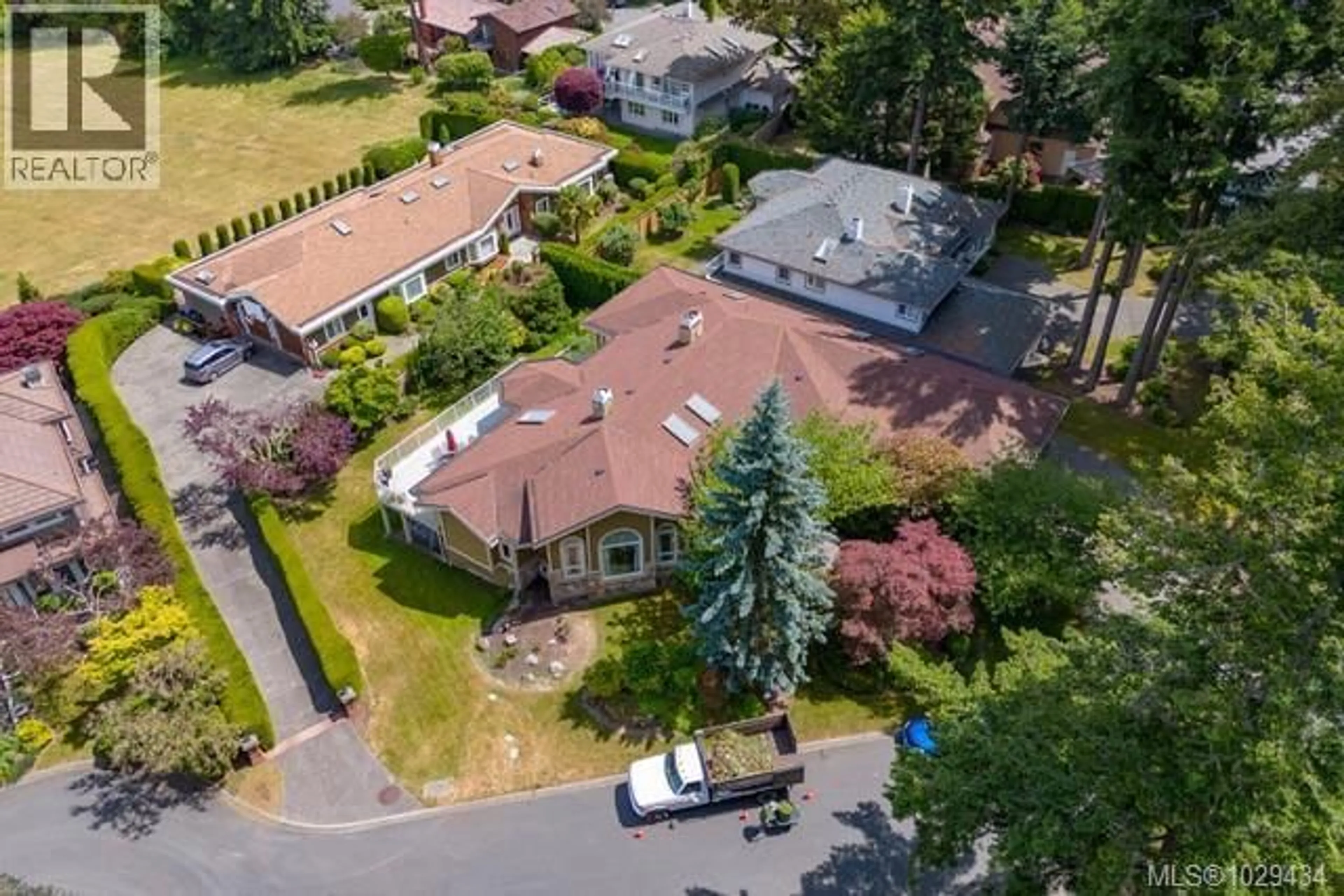 A pic from outside/outdoor area/front of a property/back of a property/a pic from drone, street for 4405 MOONLIGHT LANE, Saanich British Columbia V8N6K7